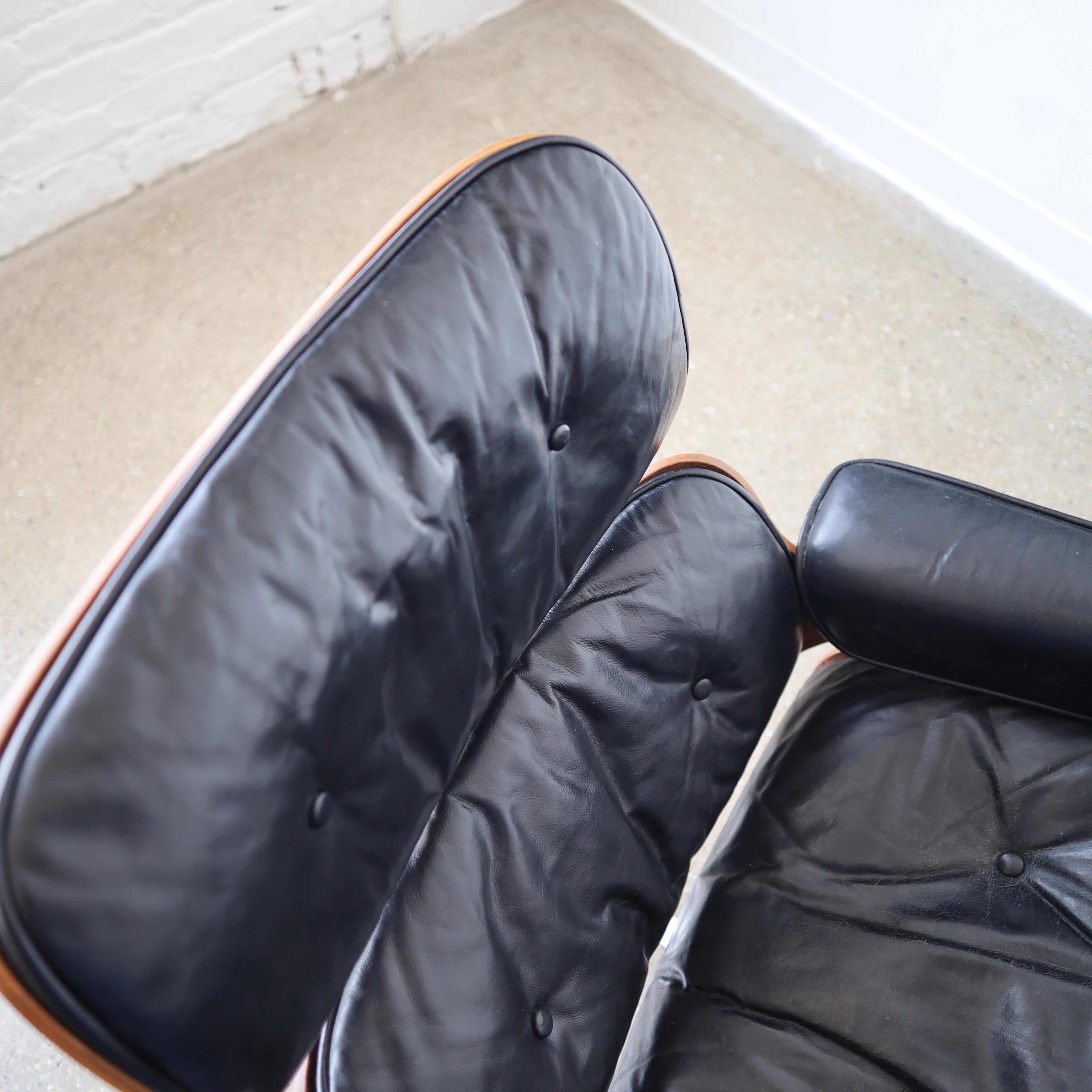 Mid-Century Modern 1960s Rosewood Eames Chair + Ottoman For Sale