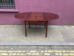 1960s Rosewood round extendable dining table by Mclntosh