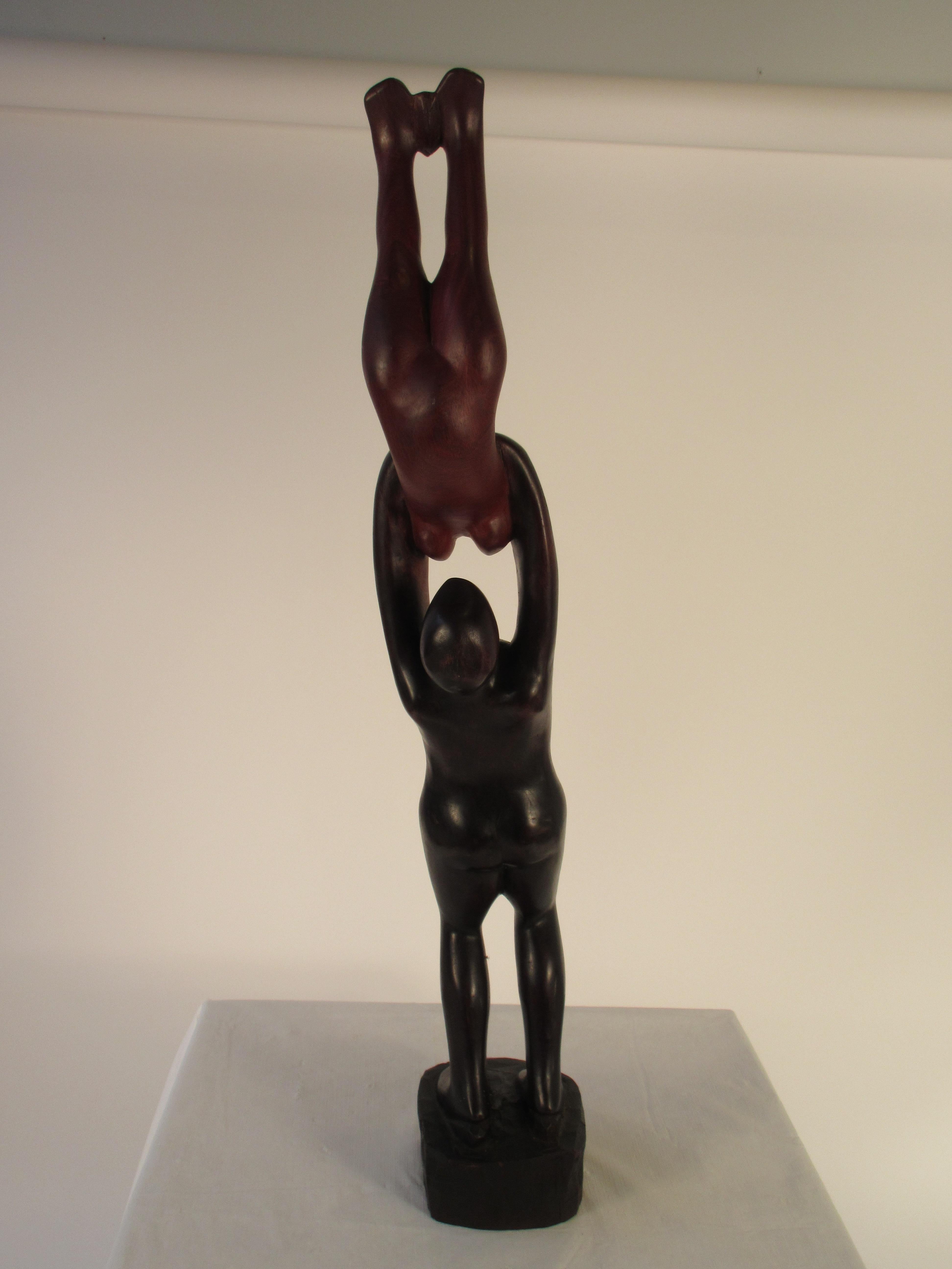 1960s rosewood hand carved sculpture of man and woman.