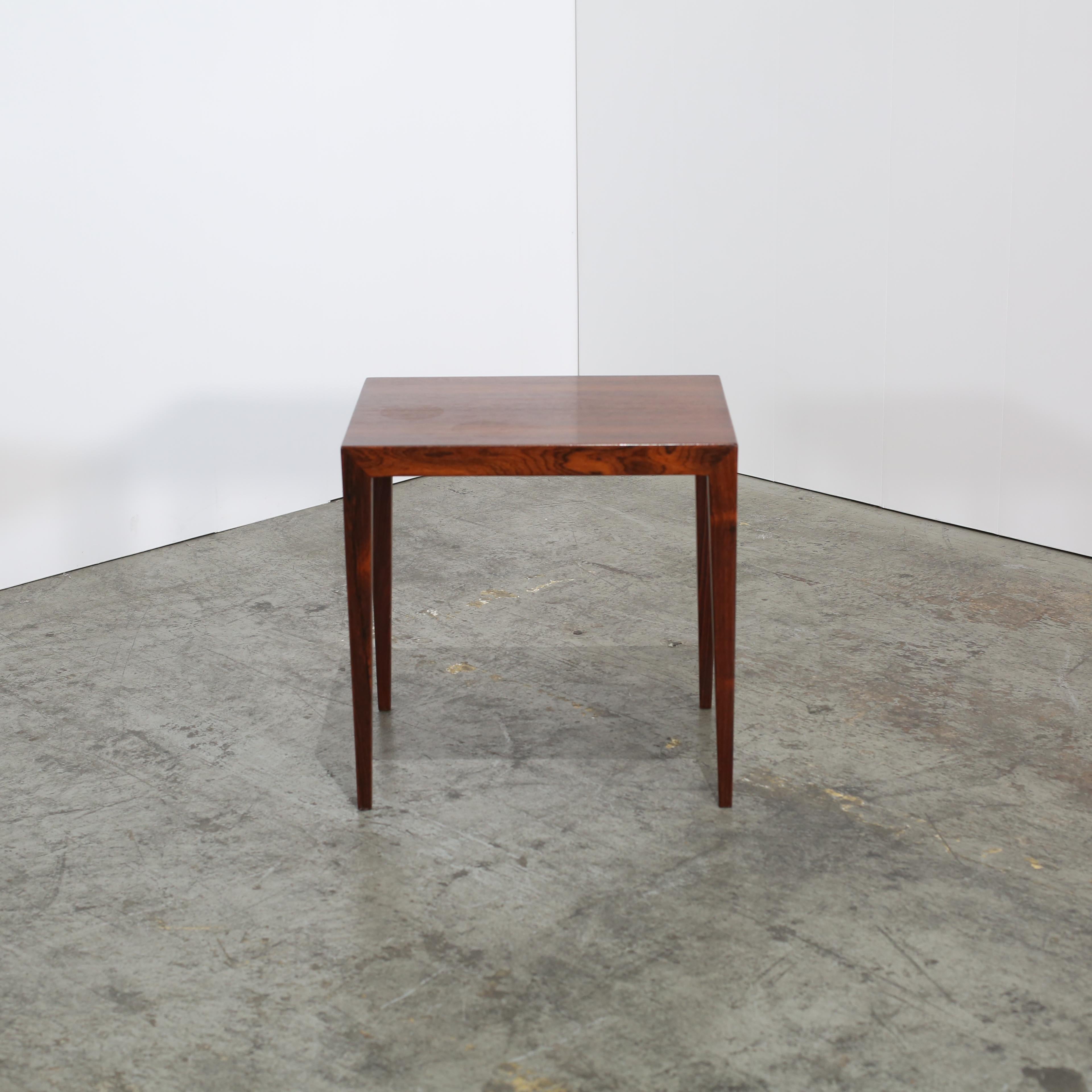 Elevate your living space with the exquisite 1960s Rosewood side table by Severin Hansen for Haslev Møbelsnedkeri. This piece exemplifies Danish mid-century modern design, showcasing Hansen's signature minimalist aesthetic and impeccable