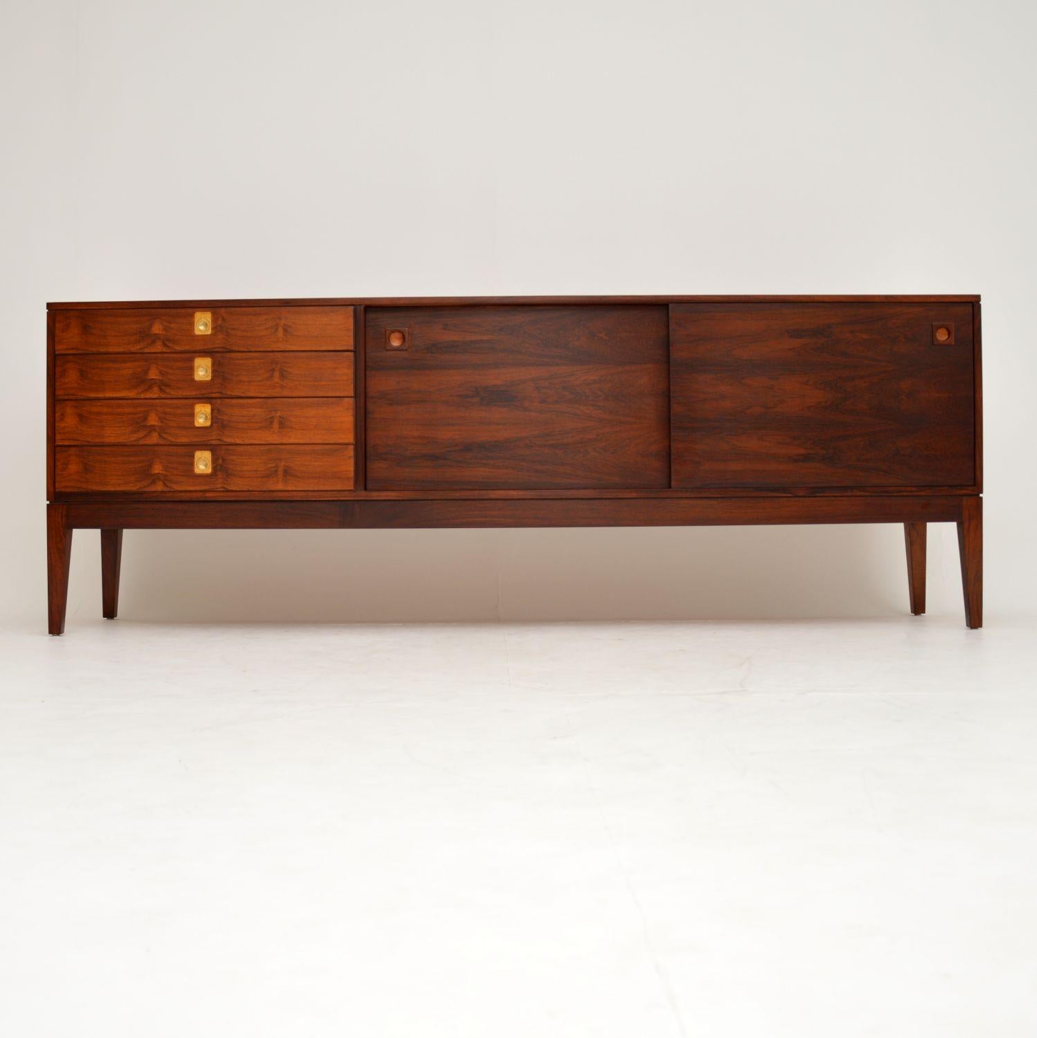 A magnificent vintage sideboard, designed by Robert Heritage for Archie Shine. This dates from the 1960s, it is in superb condition throughout. We have had it stripped and re-polished to a very high standard. The wood grain patterns and color are