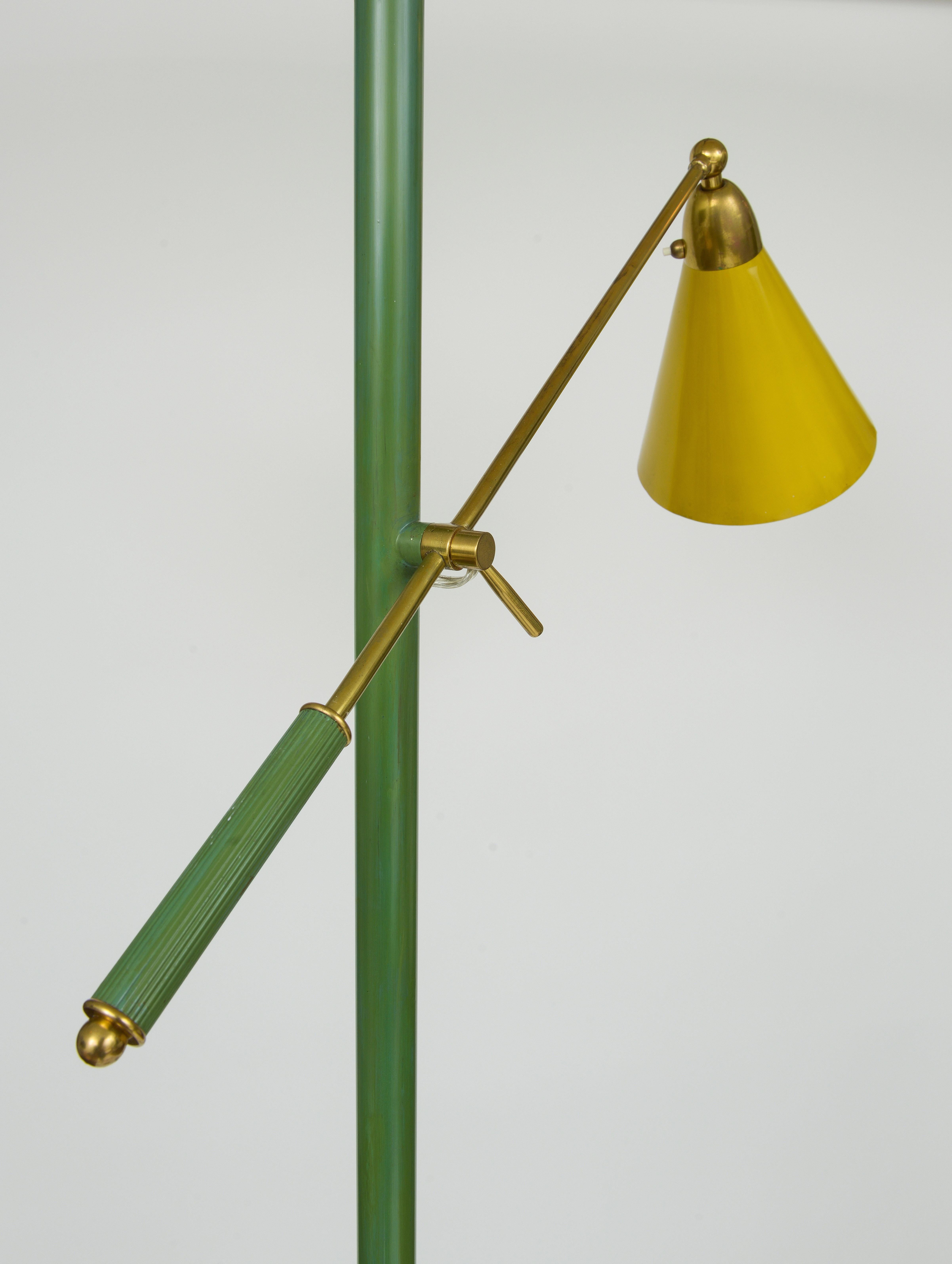 Italy, 1960's Round beige marble base green enameled stem adjustable arm with yellow shade beige enameled.
L 26 in H 78 in