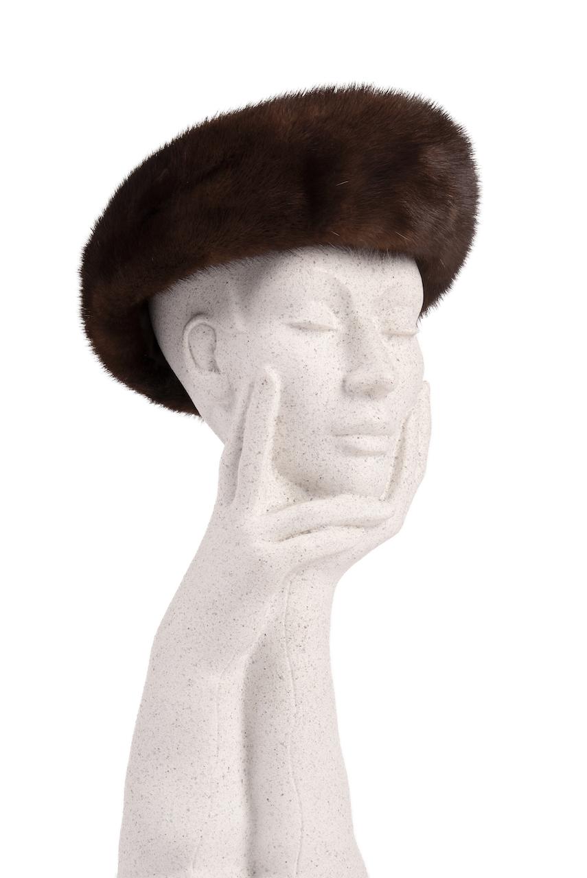 Timelessly elegant mink fur hat from the 1960s.

The flattering round hat is designed with lustrous deep chocolate brown real mink fur. The fur is soft and supple. Fully lined in dark brown acetate.

Excellent vintage condition. Appears
