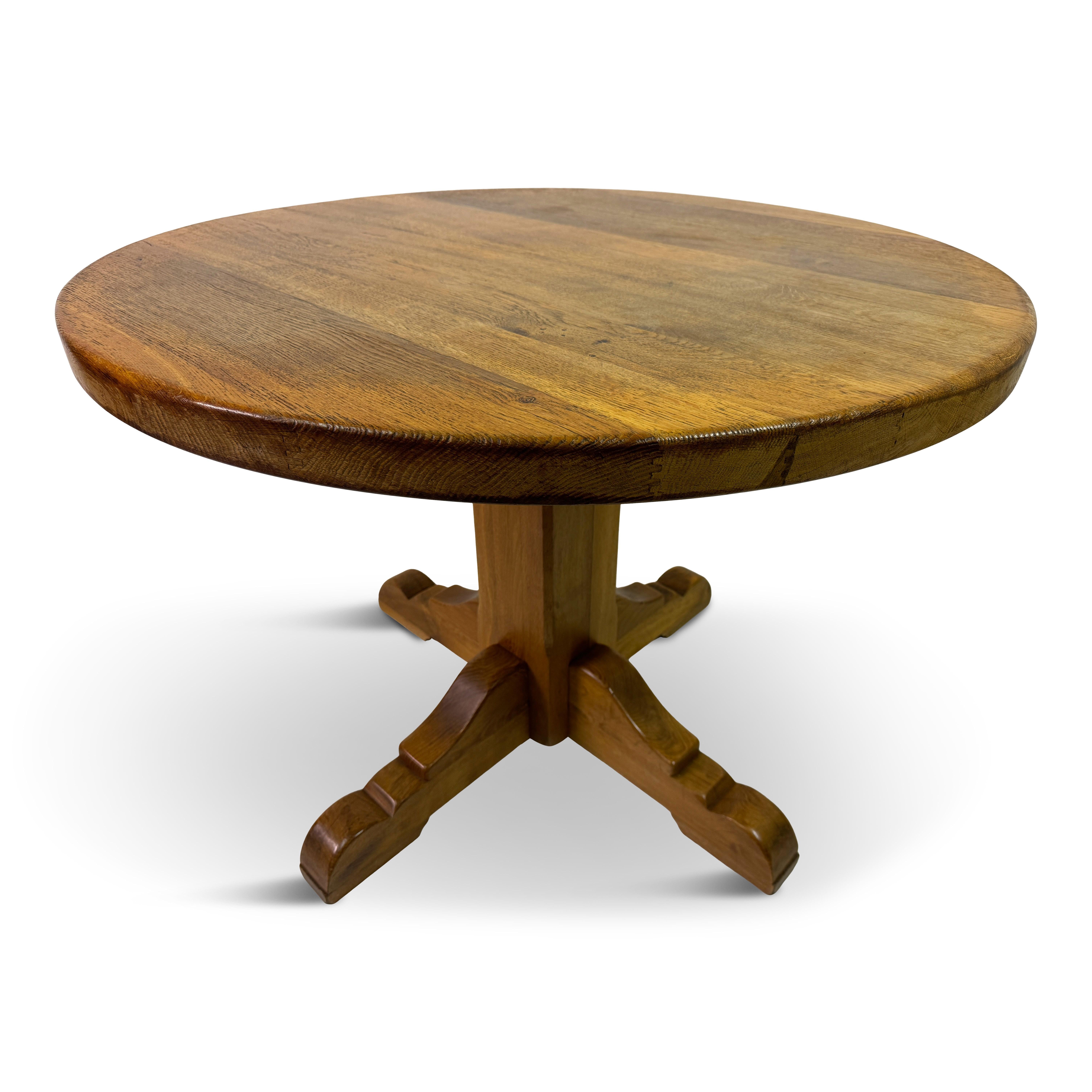 1960s Oak dining table or centre table by De Puydt

This is a beautifully crafted mid-century round dining or center table, designed in the 1960s by De Puydt. The table is made from solid oak, showcasing the natural beauty of the wood grain with a