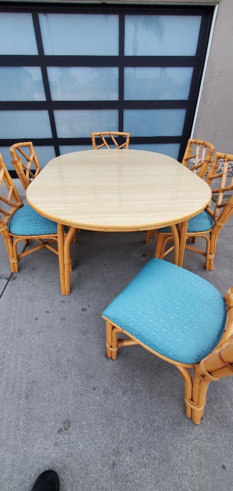 Beautifully Cared For 1960s Rattan Dining Set With Formica Top,
1 Round 1960s Rattan Dining Table With Formica Top.
1 Wide Formica Leaf To Vintage Rattan Dining Table.
6 Original Rattan Dining Chairs With Original Vintage Textured Turquoise