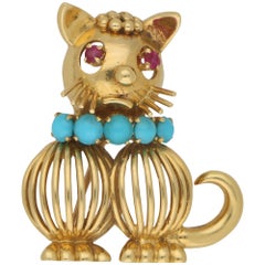 Vintage 1960s Ruby and Turquoise Cat Brooch in 18 Karat Gold by Hans Georg Mautner