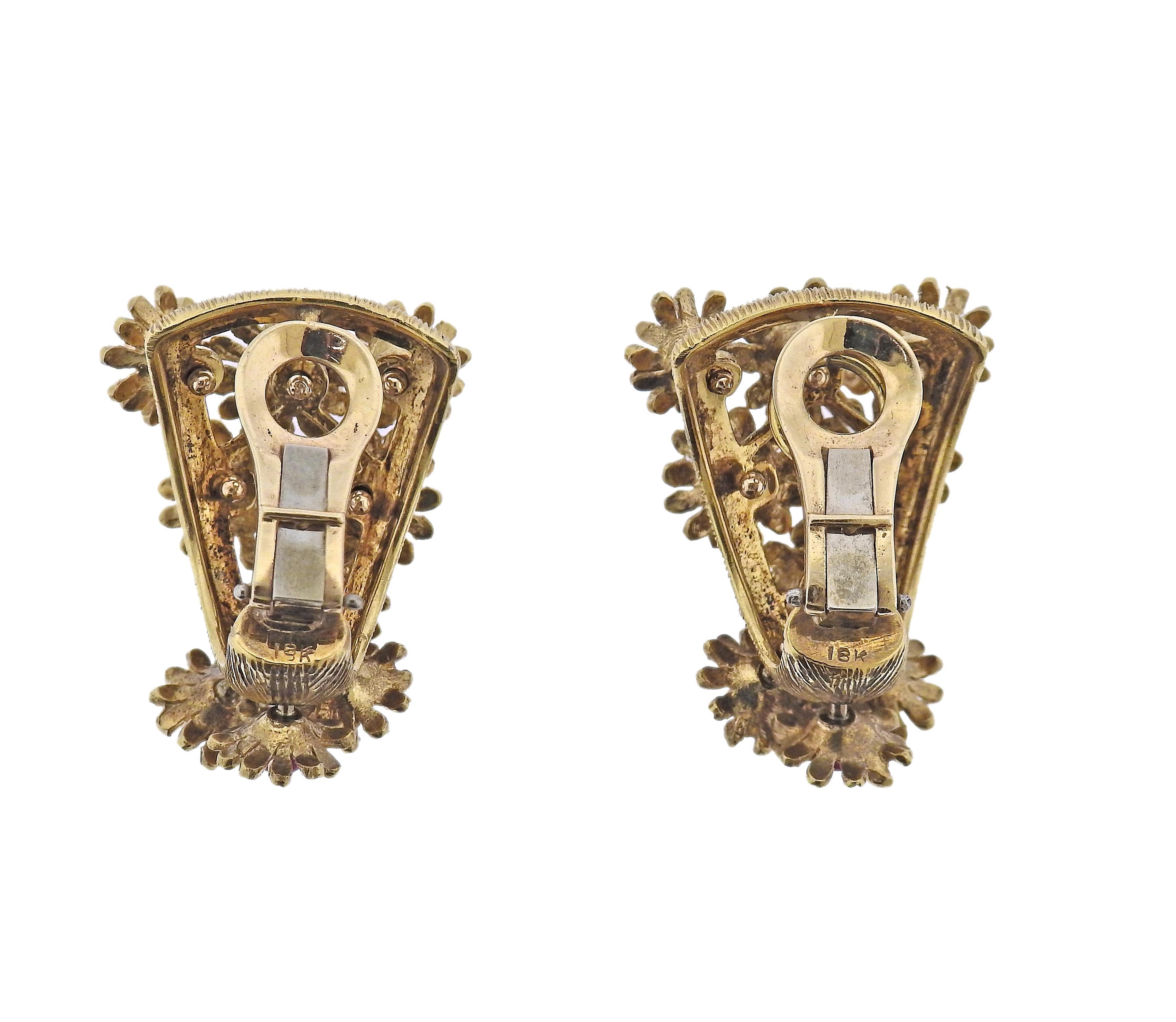 Pair of 1960s 18k gold earrings with movable flowers, set with rubies and approx. 0.20ctw in diamonds. Earrings are 32mm x 22mm. Marked 18k. Weight - 25.5 grams.