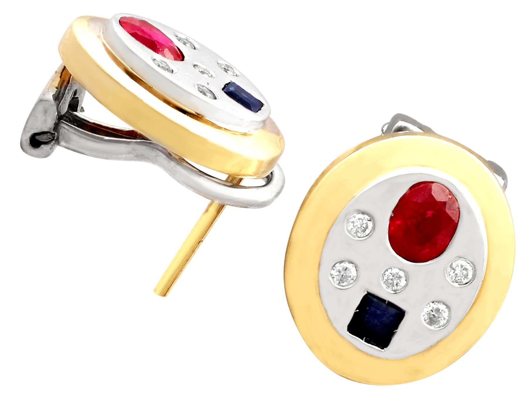 An impressive pair of vintage 0.92 carat ruby and 0.41 carat sapphire, 0.20 carat diamond and 14 karat yellow gold, 14 karat white gold set earrings; part of our diverse gemstone jewelry collections.

These fine and impressive ruby and sapphire