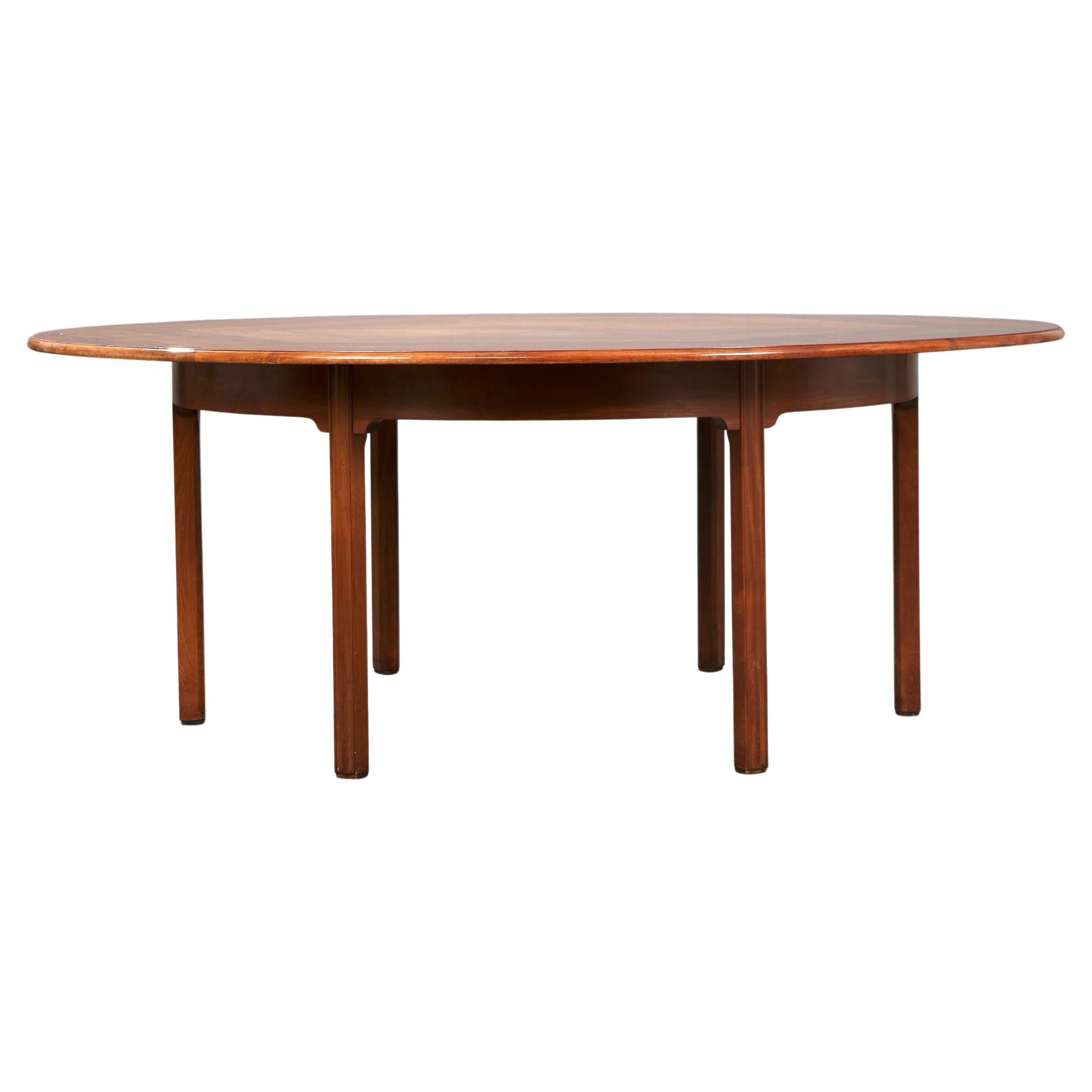 Gran "mesa china" circular Rud Rasmussen de los años 60 con armazón de seis patas