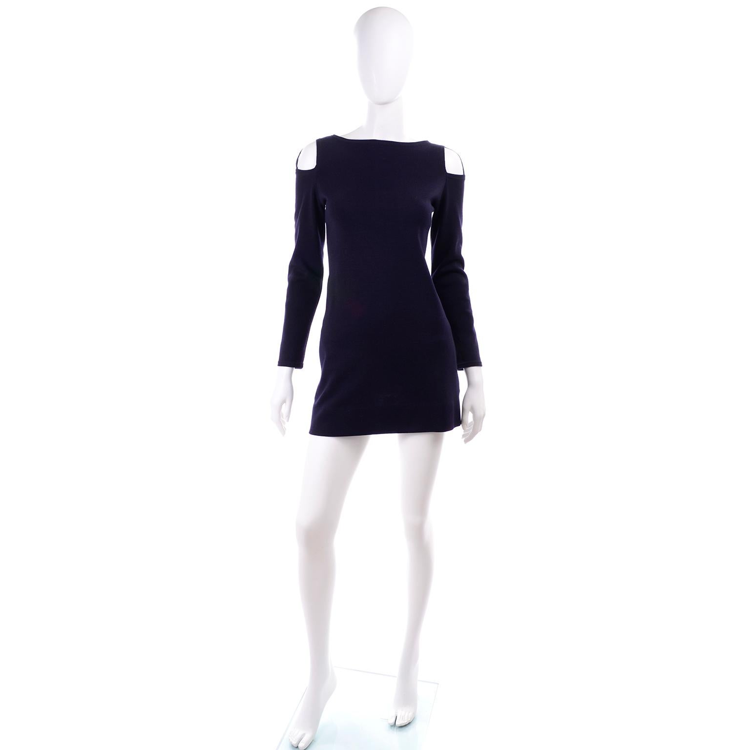 This is a fabulous vintage mini dress designed by Rudi Gernreich in the 1960's. This navy blue wool Harmon Knitwear dress has cutouts at the shoulders, side slit pockets, and closes with a back zipper and a hook and eye. Rudi Gernreich became famous