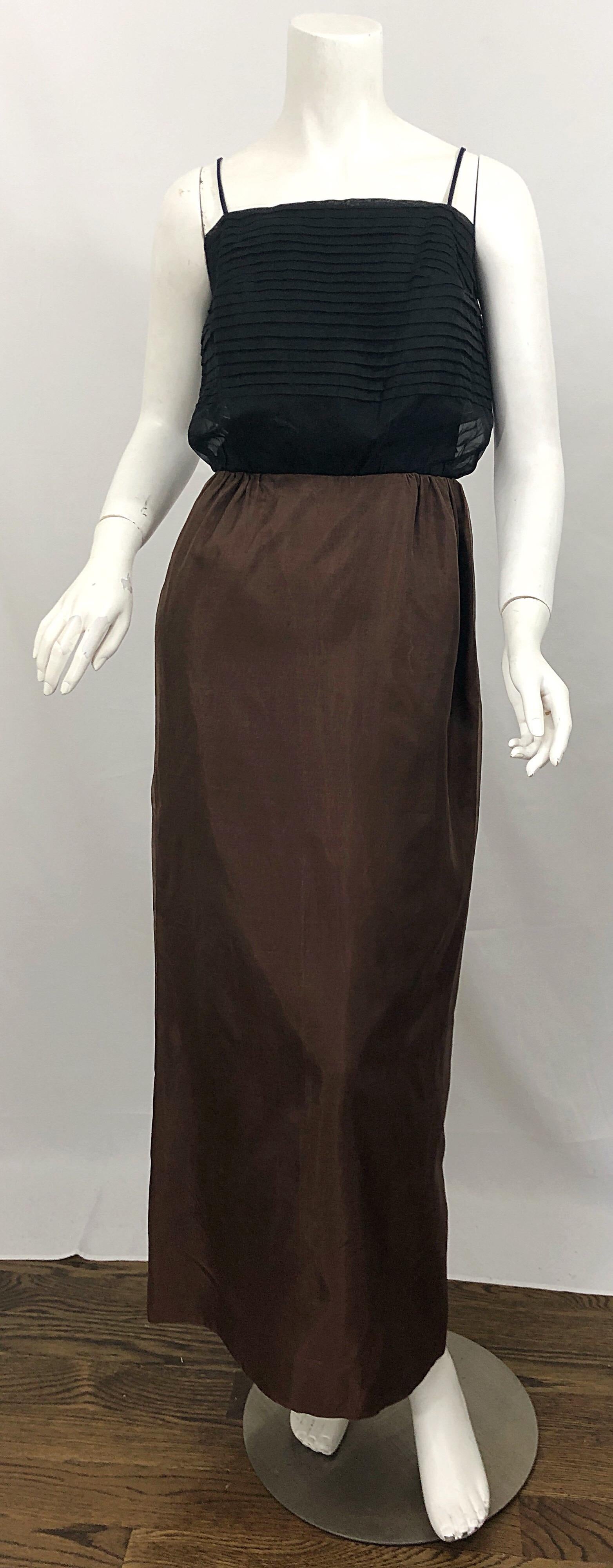 Beautiful early 60s vintage S. HOWARD HIRSH chocolate brown and black silk chiffon vending dress! Features a black paneled bodice, with a brown full length skirt. Slit at back center hem. Both the bodice and the skirt feature a gorgeous semi sheer