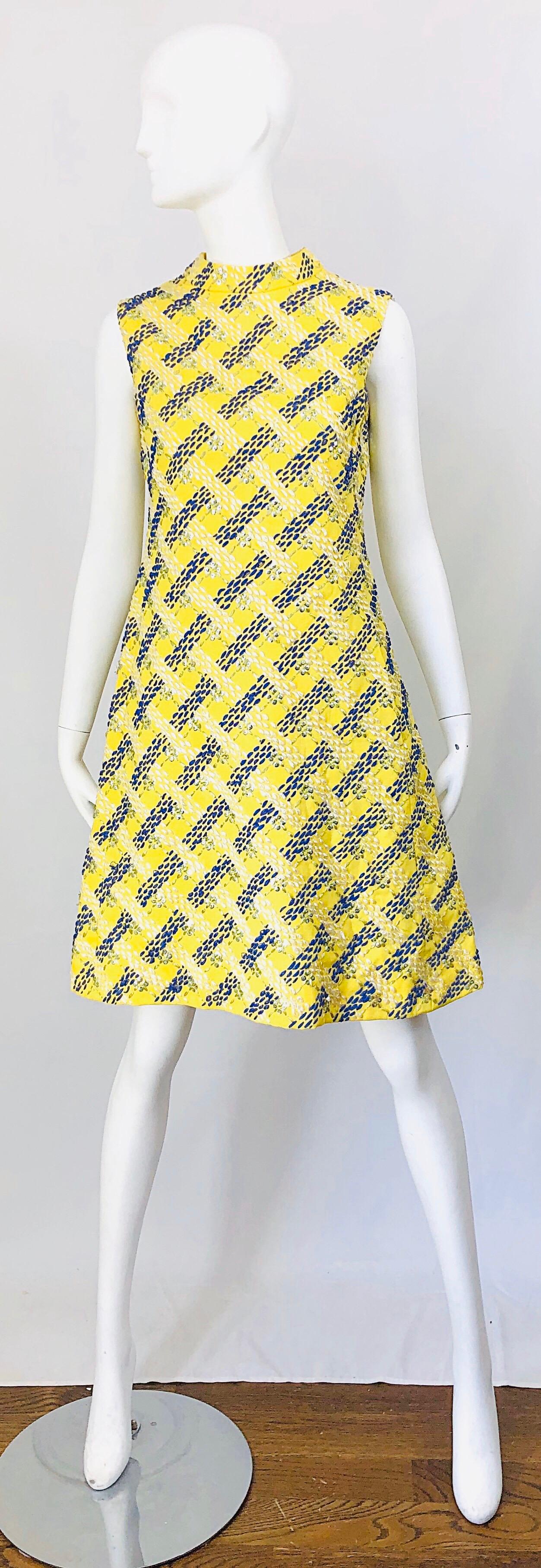 Chic vintage 60s SAKS 5th AVENUE canary yellow, light blue and white linen embrodiered raffia linen sequin 
A - Line dress! Features a luxurious Irish linen in canary yellow. Raffia embroidery in light blue and white. Hundreds of silver sequins hand