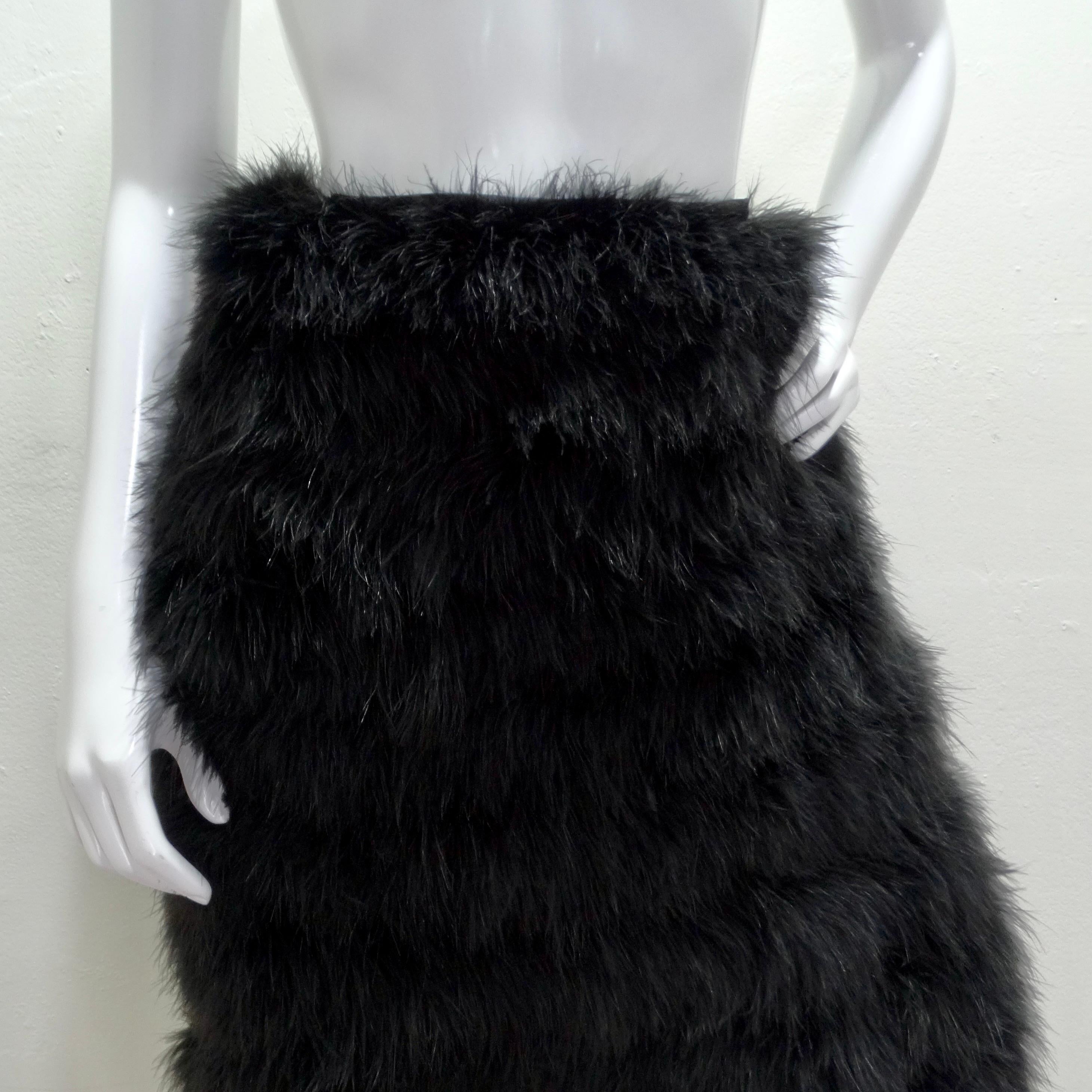 Introducing the exquisite 1960s Saks Fifth Avenue Black Marabou Feather Midi Skirt, a statement piece that exudes luxury and sophistication. Crafted with meticulous attention to detail, this mid-length skirt is a true work of art, perfect for making