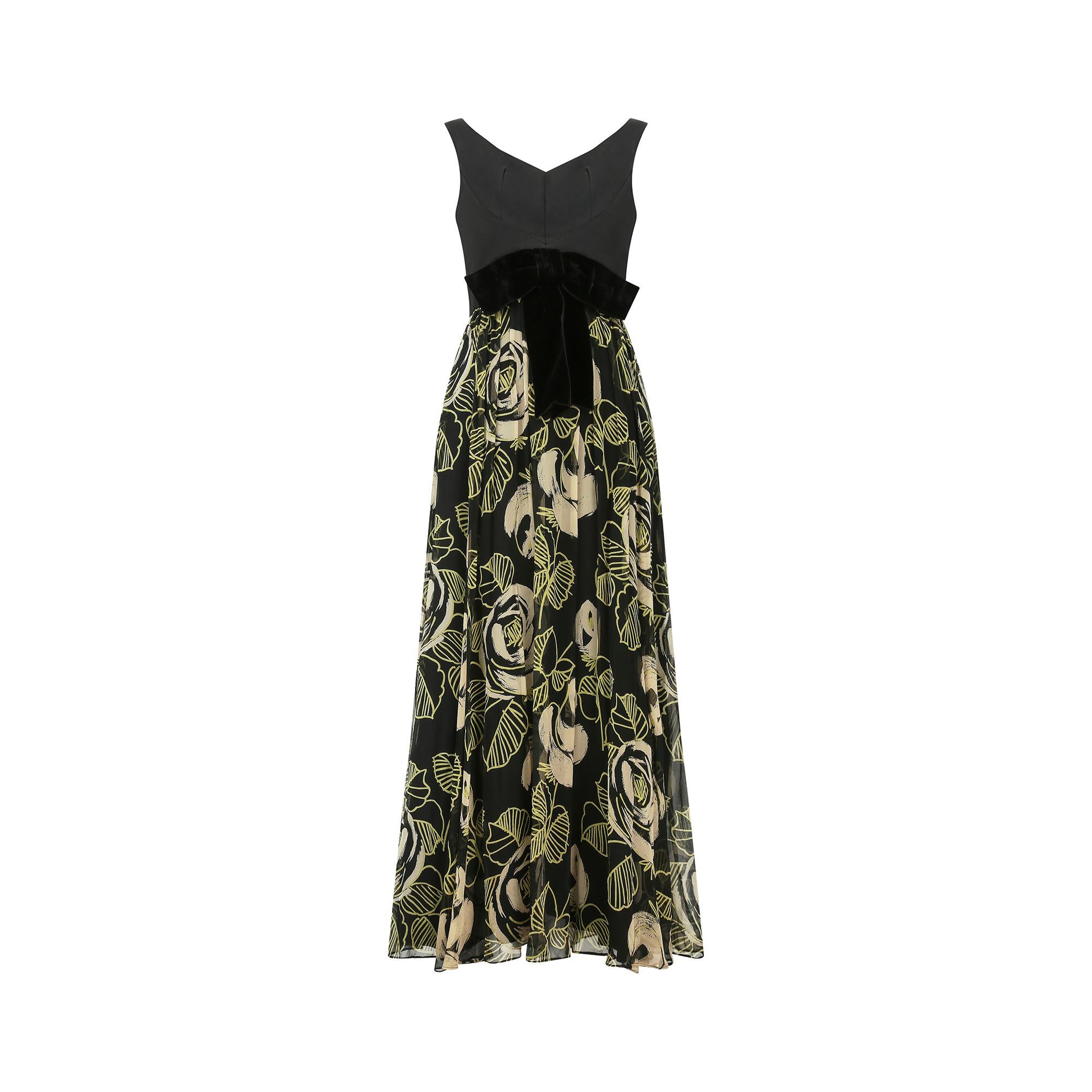 Superb mid 1960s Saks Fifth Avenue floral maxi evening dress with a soft silk bodice, with beautiful darts under the bust which create a lovely feminine silhouette. It has a gentle V shaped sweetheart neckline to both the front and back, with slim