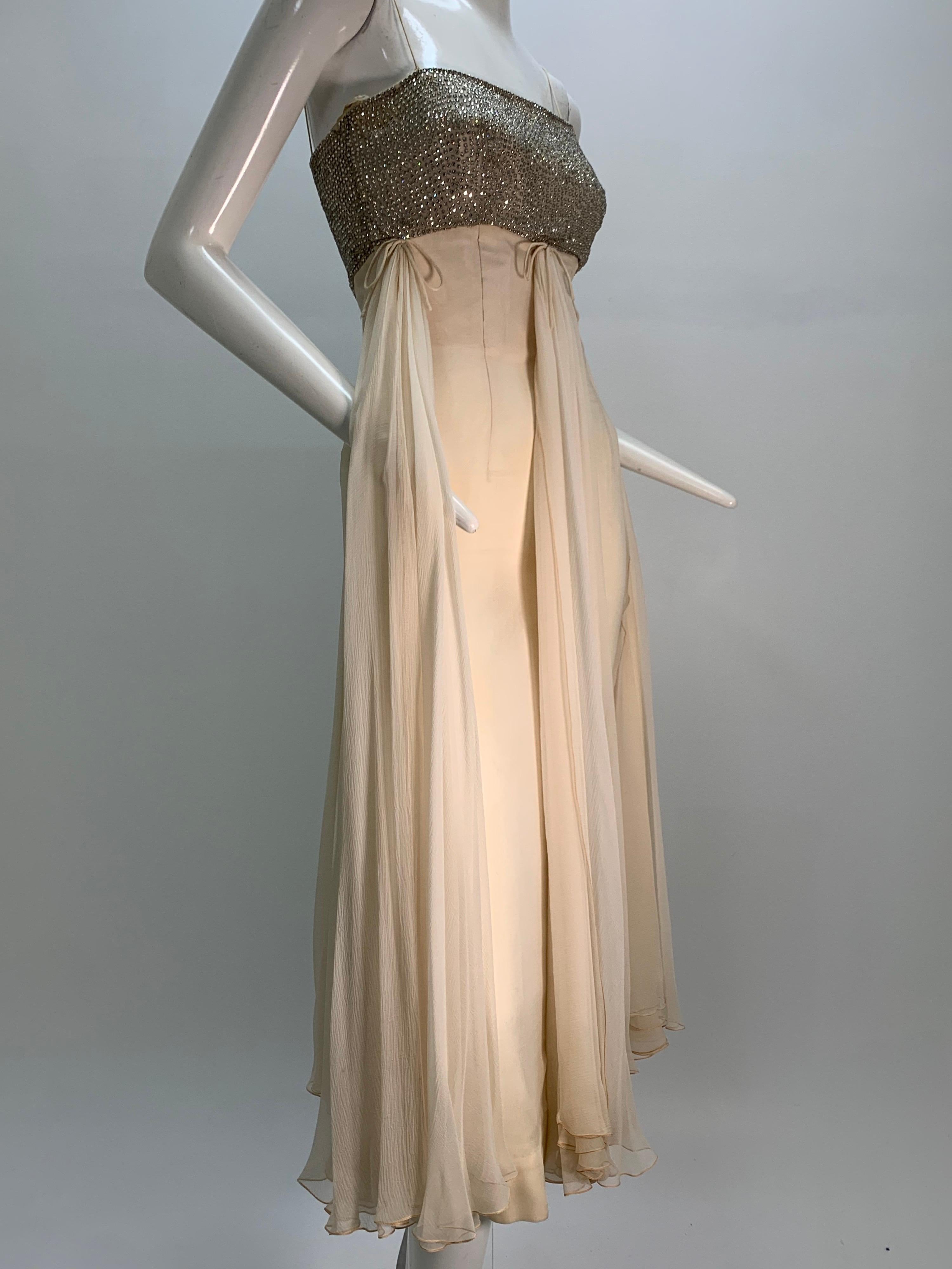 1960s Saks Fifth Avenue Cream Silk Chiffon Sheath Dress w/ Rhinestone Encrusted Bodice: Heavily boned and structured bodice is entirely encrusted with rhinestones supported by tiny spaghetti straps. Empire waist with fitted and lined chiffon sheath.