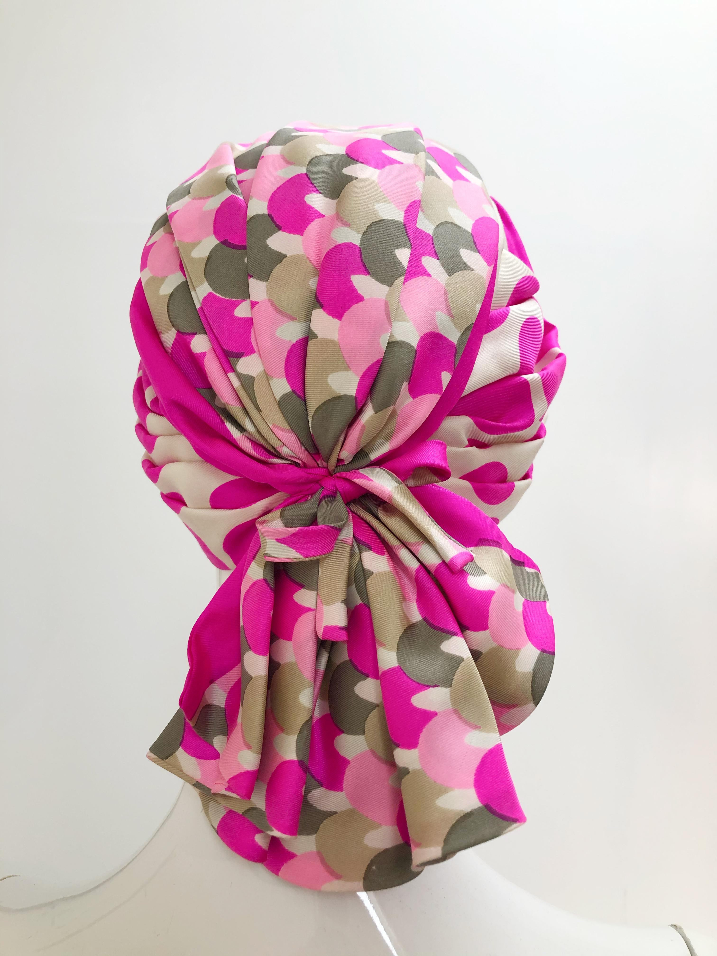 A chic Saks Fifth Avenue 1960s pink polka dot and mixed graphic silk pleated turban with fan-tail pleated flourish at back. Size M-L.