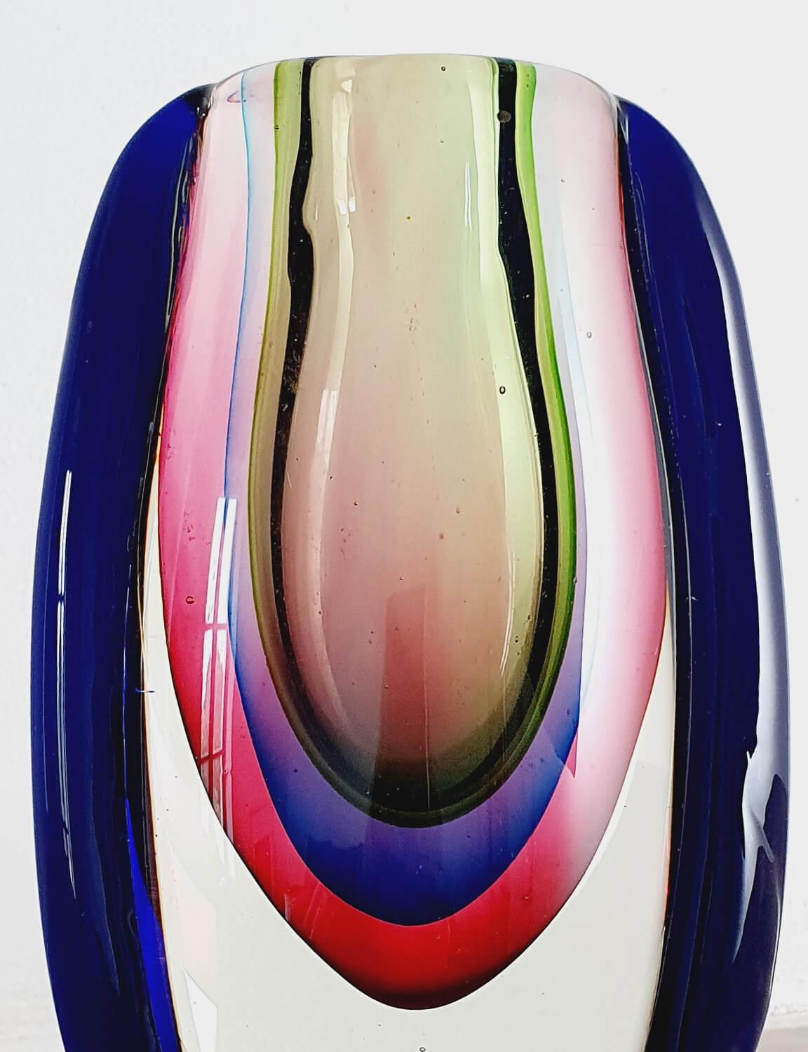 Salviati is one of the World's most renowned glass blowing furnaces in Venice. It was founded in 1859 and has since then produced some of the most desirable pieces of Murano glass. This piece is a rare quadruple sommerso (submerged) glass Vase. A