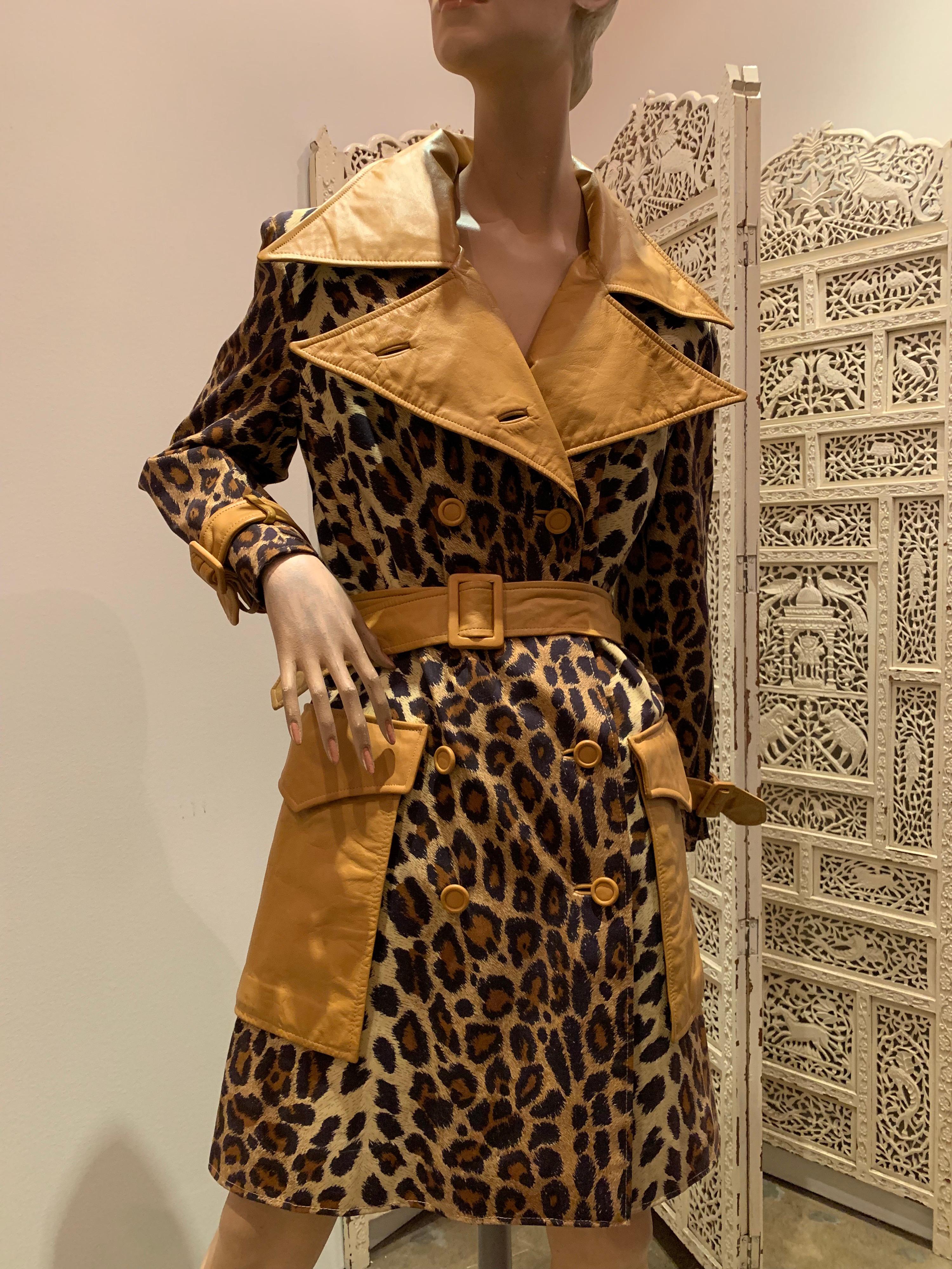 A fabulous late 1960s Samuel Robert leopard stenciled canvas trench coat with butterscotch leather notched collar, belt, buttons and pocket details. Lined in cotton. 