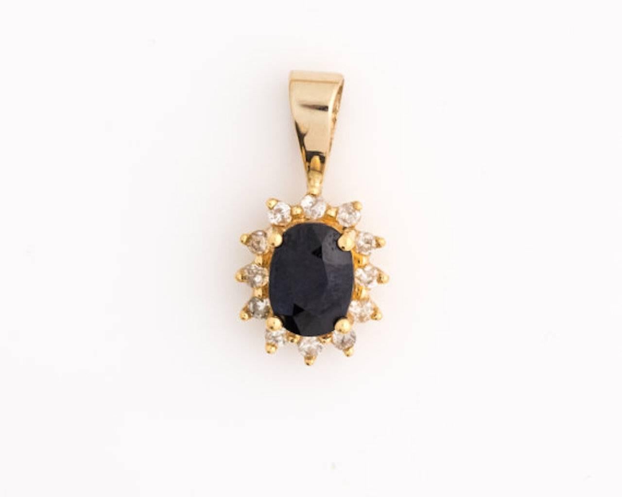 1960s Retro Sapphire Pendant - 14k Yellow Gold, Sapphire, Diamonds

Features an oval Sapphire in a 4-prong, elevated setting. This deep blue center stone is surrounded by a 12-Diamond Halo. 
The large bail loop will fit most necklace chains.
The