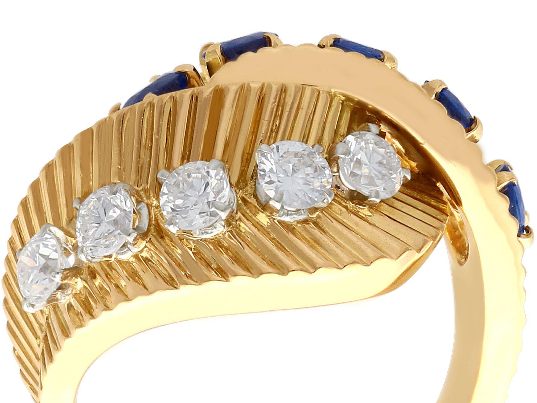 A stunning, fine and impressive vintage 0.69 carat sapphire and 0.55 carat diamond, 18 karat yellow gold cocktail ring made by Van Cleef and Arpels; part of our diverse antique jewelry and estate jewelry collections.

This stunning, fine and
