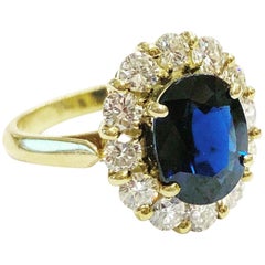 Vintage 1960s, Sapphire and Diamonds Halo 18k Yellow Gold Cluster Ring