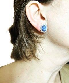 1960s, Sapphire Star Cabochon and Diamonds Halo 18k white Gold Cluster Earrings