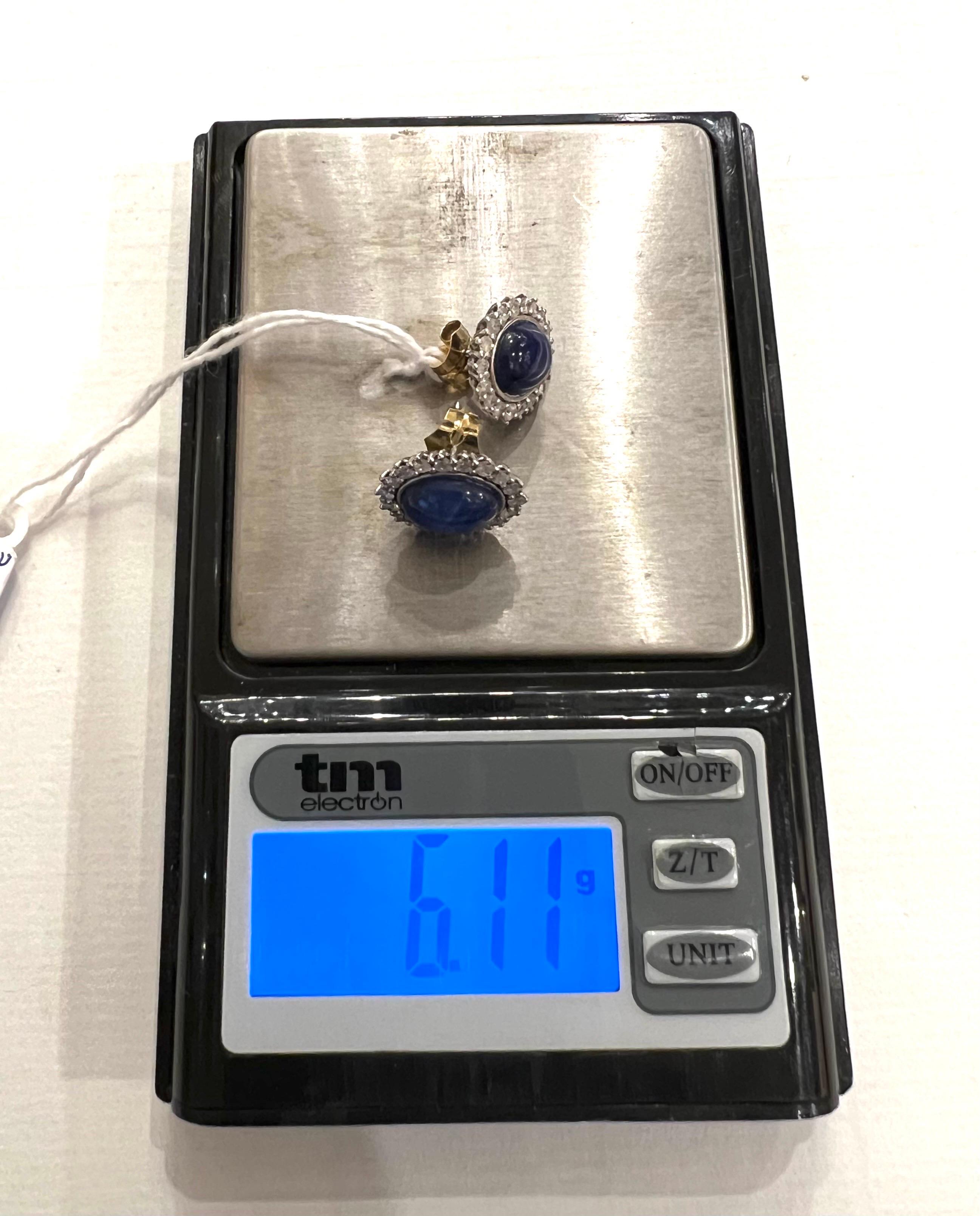 Women's 1960s, Sapphire Star Cabochon and Diamonds Halo 18k white Gold Cluster Earrings For Sale