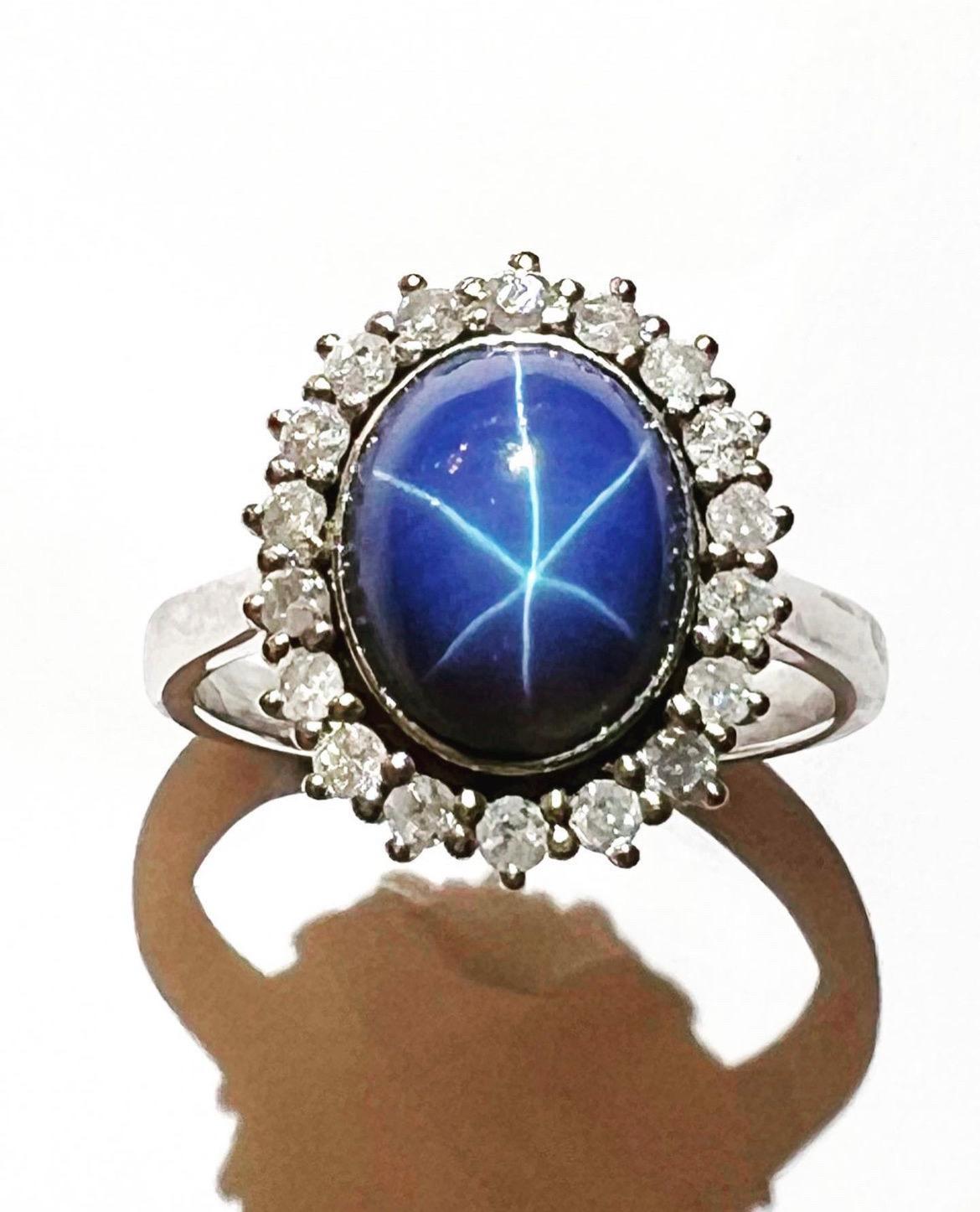 Modern 1960s, Sapphire Star Cabochon and Diamonds Halo 18k white Gold Cluster Ring For Sale