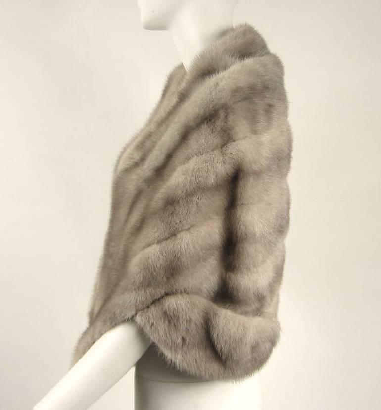 Lovely Mink Stole with Inset shoulders and Slit Pockets -Soft and supple Mink - Great arm detailing See back photo - Will fit Medium. Measuring Long down the front 22 in Long down the back 17.5 in. Please be sure to check our storefront for more