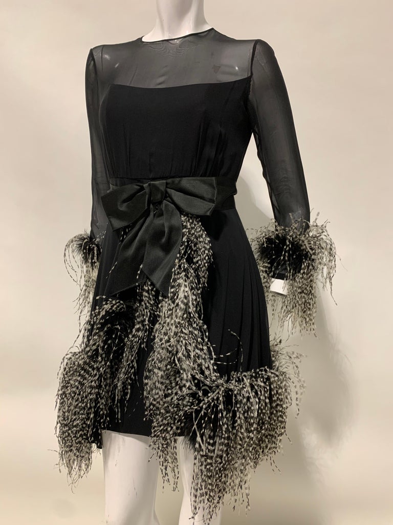 1960s Sarmi Mod Black Silk Chiffon Dress with Ostrich Feather Trim Overlay Skirt & Bow: Extravagant black and white ostrich trim embellishes this Mod delight. Skirt overlay is finished separately in a hostess style. Size 6-8.