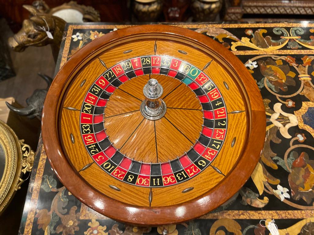 1960s Satinwood and Mahogany Roulette Wheel from the Ritz Hotel Casino in Paris. Made and signed by A.B.P London.

Full size roulette wheel. Fully working, 79cm diameter, with fitted box.

Hôtel Ritz Paris The Ritz Paris is a hotel in central