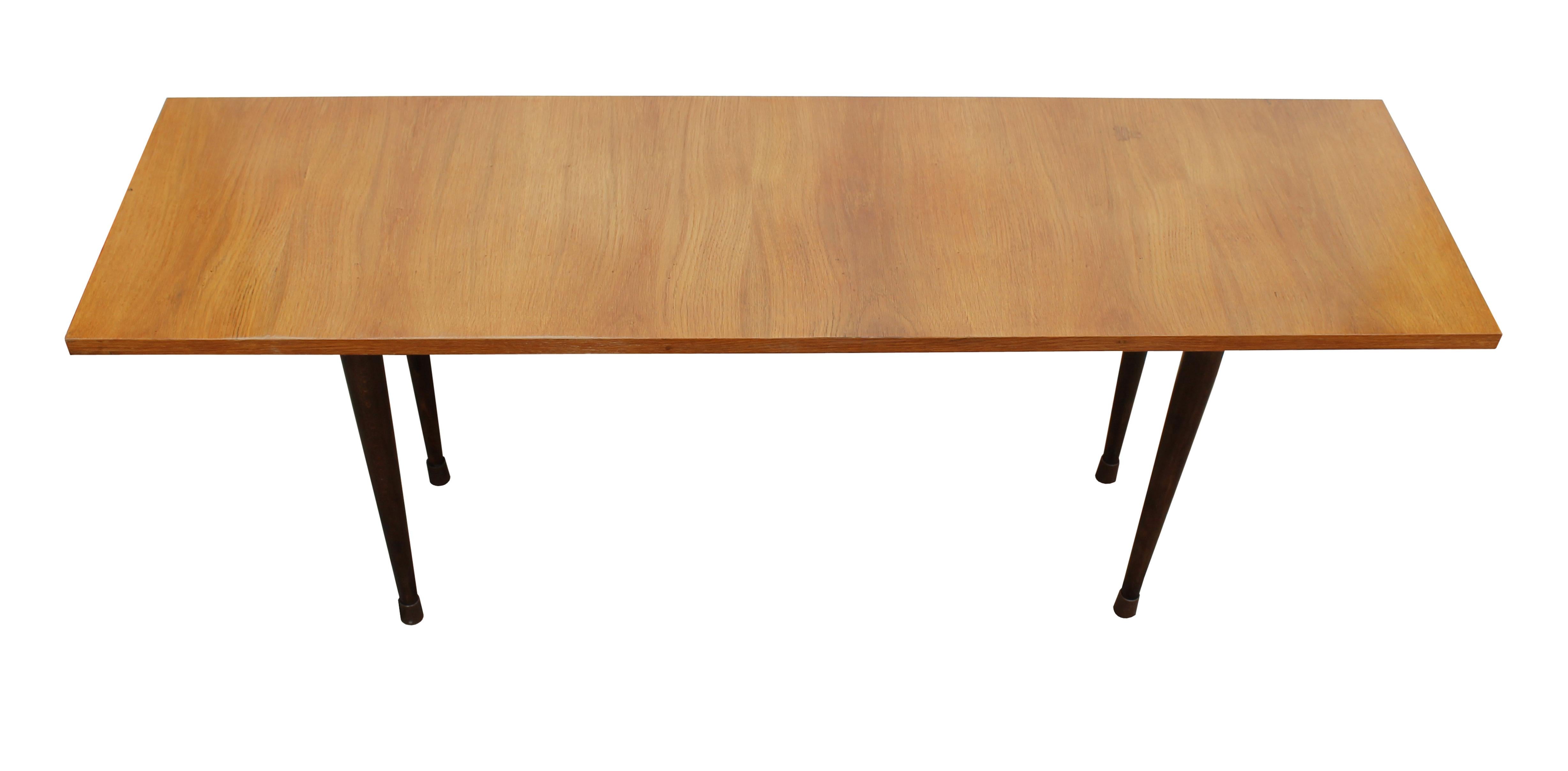 A long wooden coffee table designed in the style of Scandinavian Modern, but produced in Czechoslovakia in the late 1960’s.

In the 1960’s, the Czech furniture design was largely influenced by Scandinavian design. This influence is noticeable on
