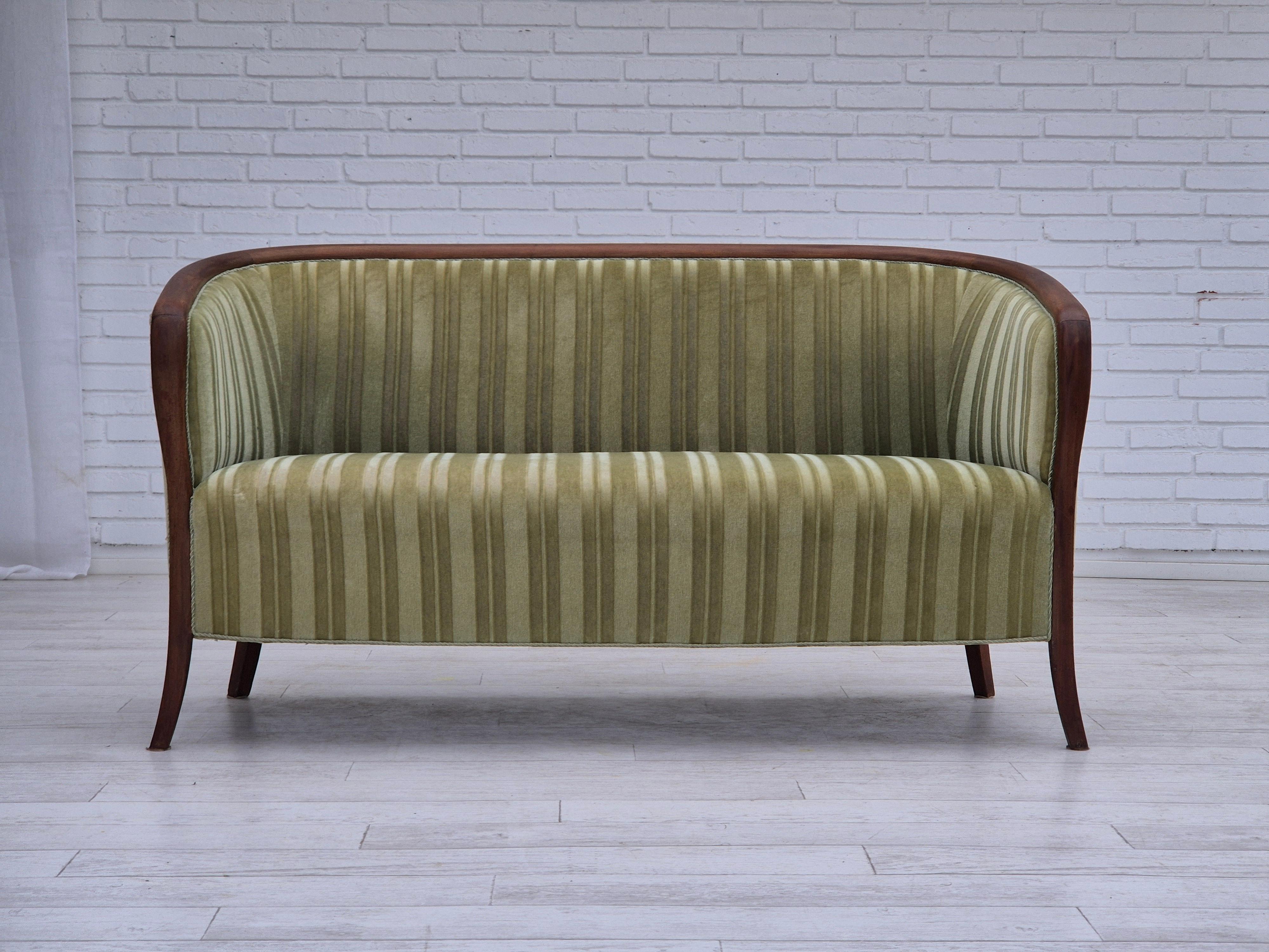1960s, Scandinavian 2 seater sofa. Original very good condition: no smells and no stains. Original light green furniture velour, teak wood. Springs in the seat. Manufactured by Danish or Swedish furniture manufacturer in about 1955-60s.