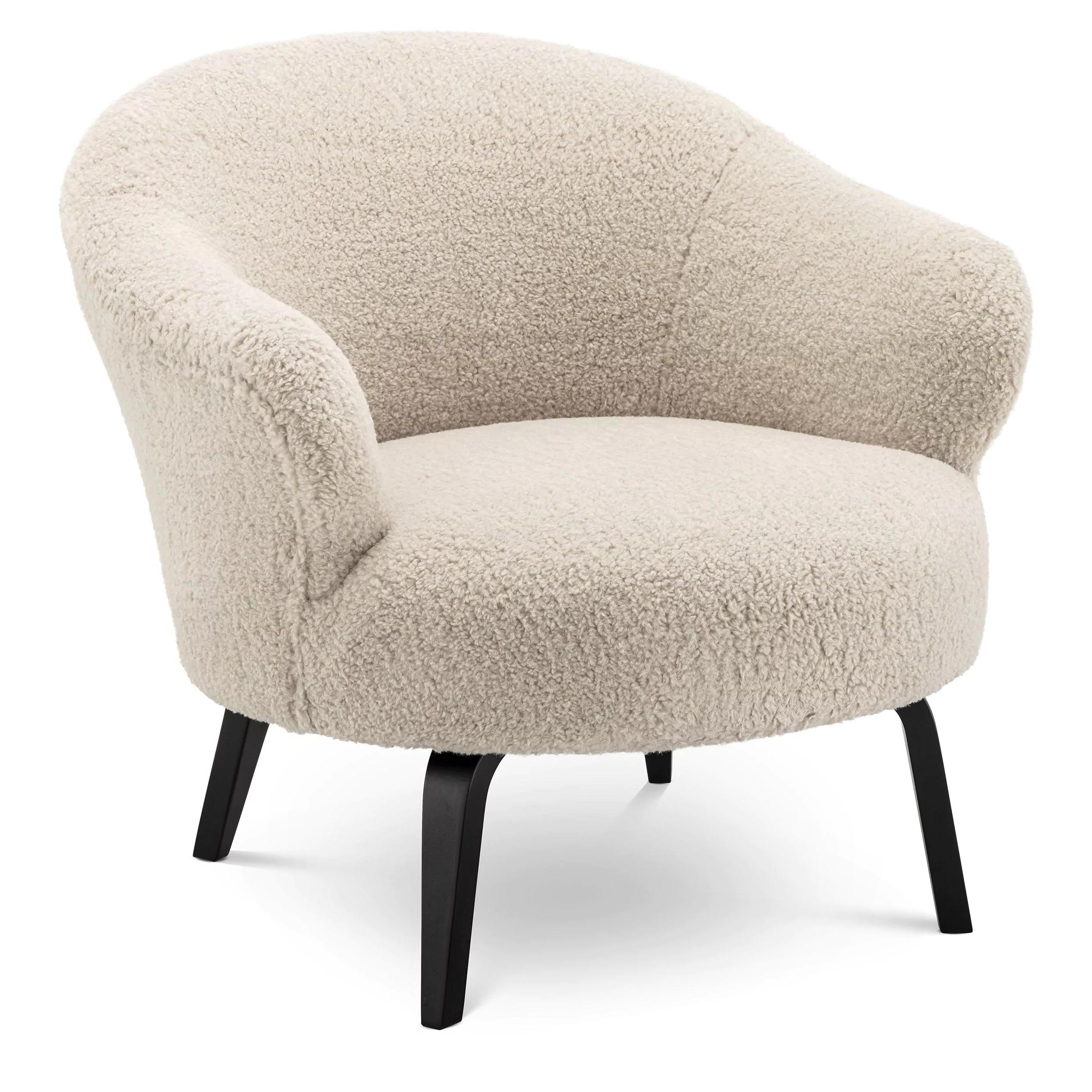 Vintage style and MCM design black wooden feet with beige Bouclé fabric fur effect rounded shaped armchair.