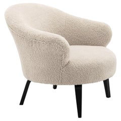 Fauteuil en tissu bouclé et pieds noirs de style MCM et de design scandinave des années 1960