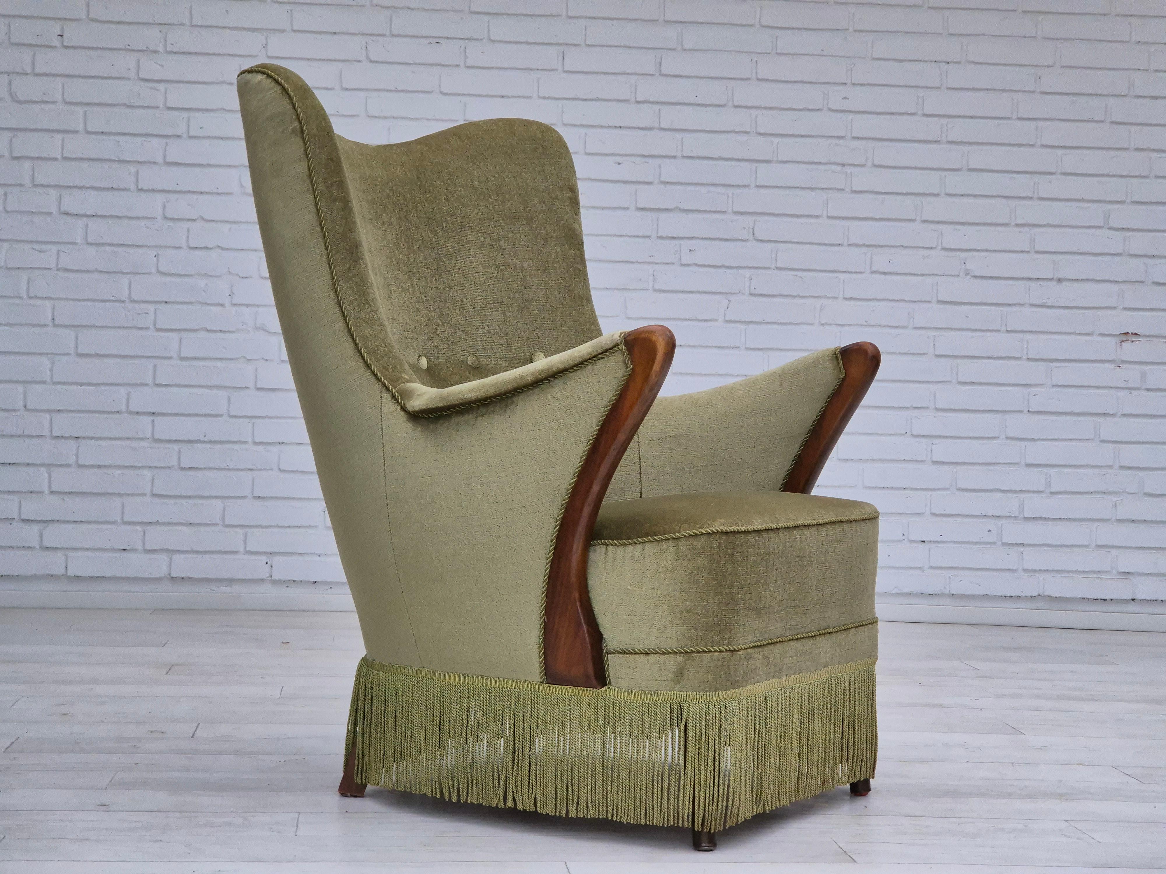 1960s, Scandinavian design. Armchair in original very good condition: no smells and no stains. Light green furniture velour, beech wood legs with brass plugs. Brass springs in the seat. Beech wood legs and armrests. Manufactured by Danish or Swedish