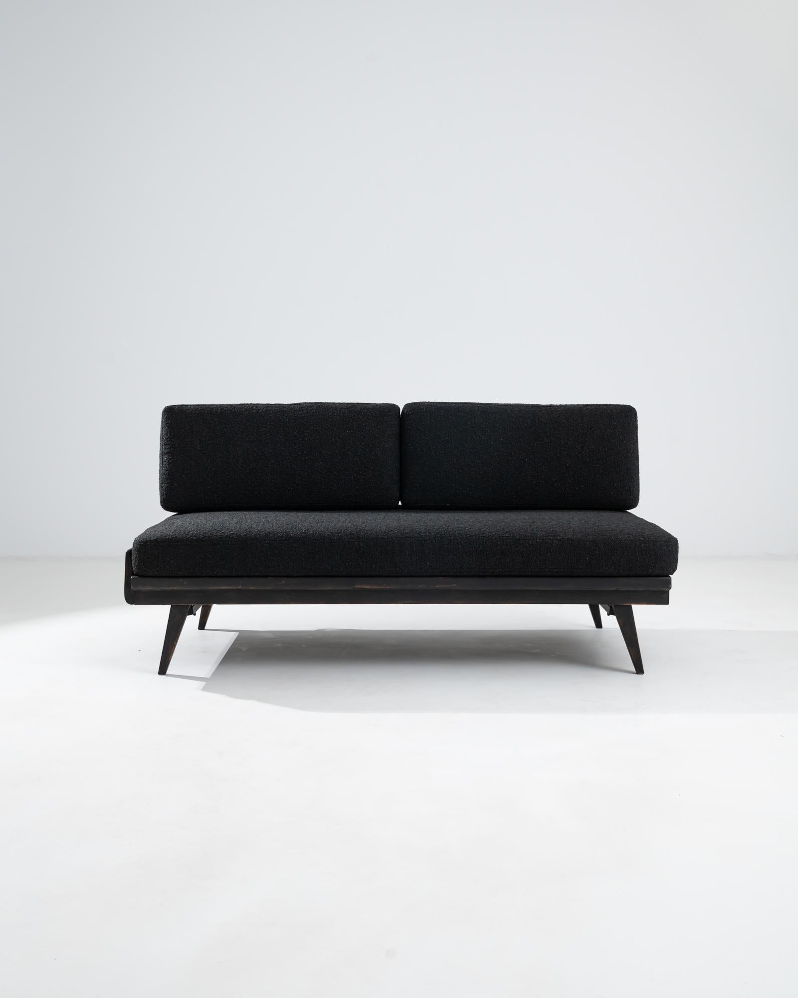 A Scandinavian upholstered sofa from the 1960s. Scandinavian Modern design is famous in its blend of form and function, his sofa is true to its lineage with an elegant combination of mechanical design. Metal tubes connect attractively to its lightly