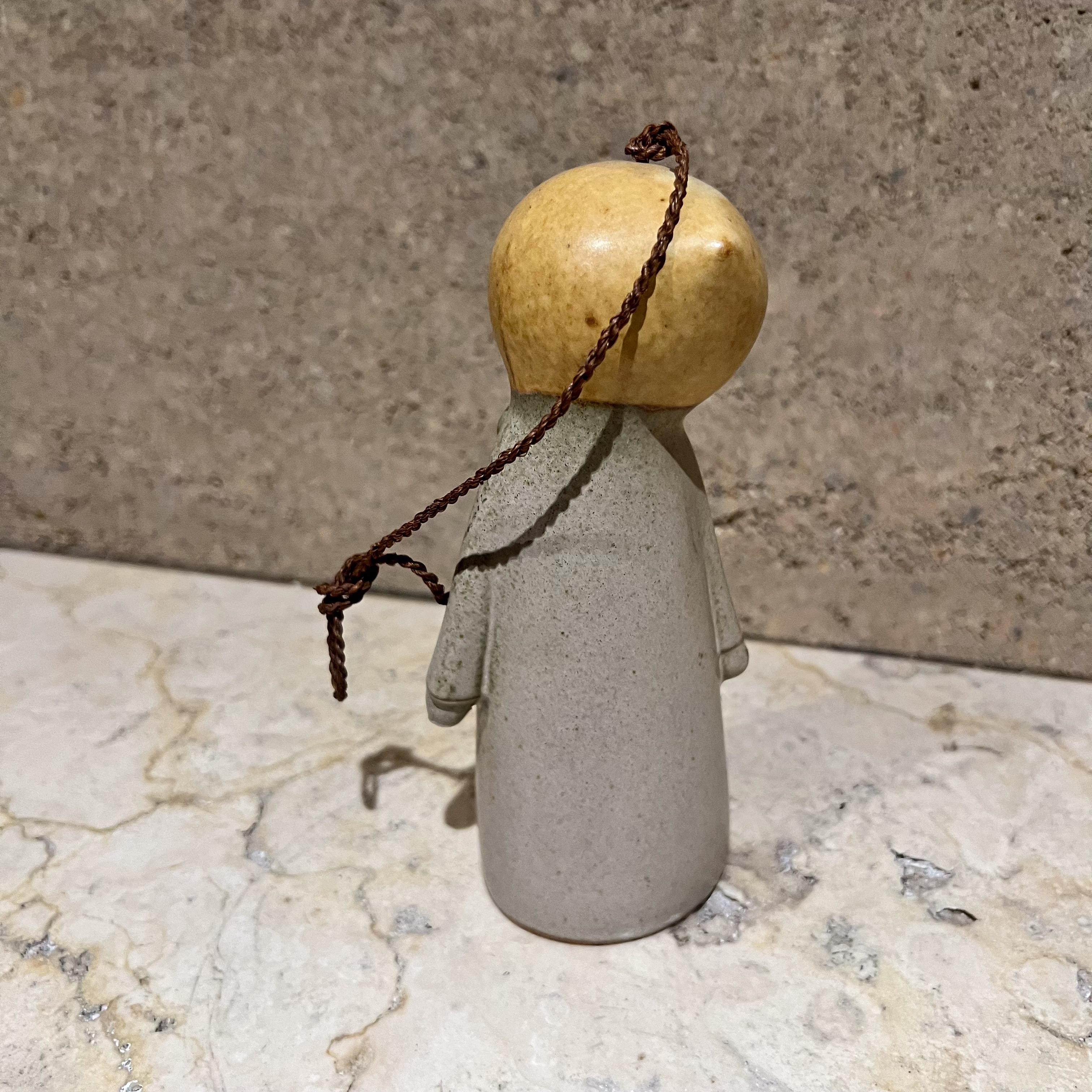 AMBIANIC presents
Vintage Doll Shaped Scandinavian Bell Handmade Art Pottery 
Unmarked.
13.5 with rope 7.5 h without rope x 3 w x 2.5
Unrestored preowned vintage condition
See images provided.

 