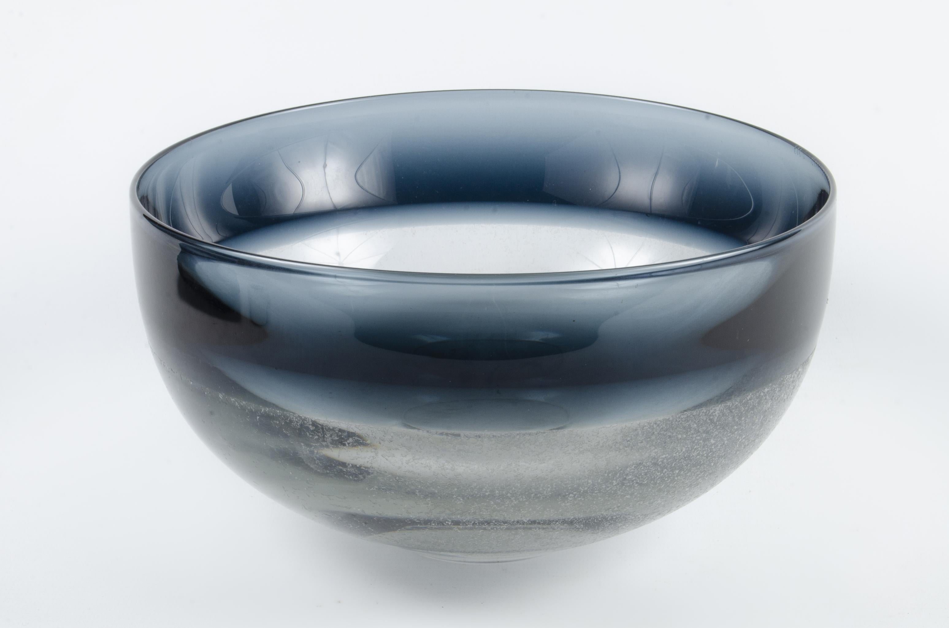 1960s Scandinavian Modern blue-tinted art glass decorative bowl by Timo Sarpaneva, Finland

By: Timo Sarpaneva
Material: glass, art glass
Technique: molded, pressed, hand-crafted
Dimensions: 9 in x 4.75 in
Date: mid-20th century, circa 1960
Style: