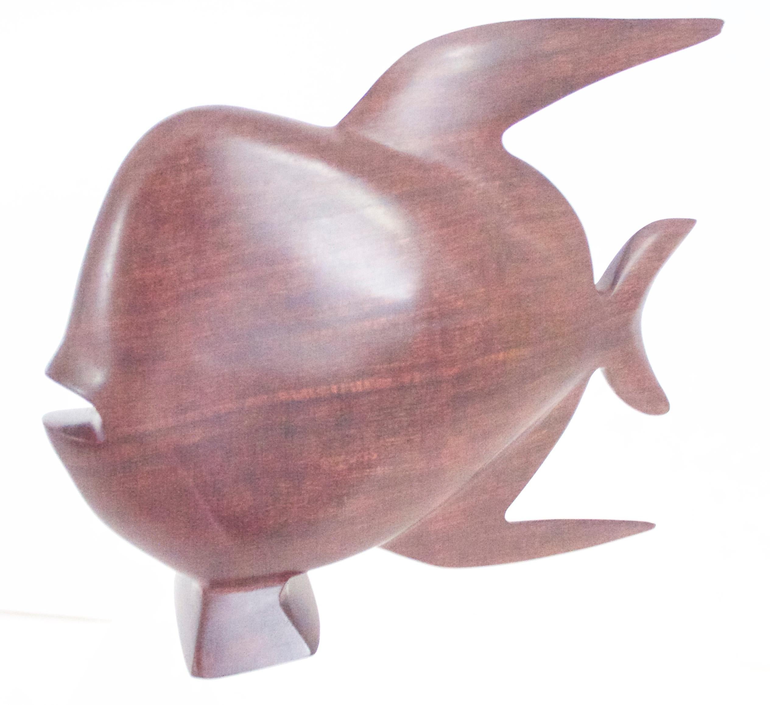 1960s Scandinavian Modern ironwood/rosewood sculpture of a fish, late 1950s

Measures: Height 17 cms, length 23 cms, weight 0.742 kgs.