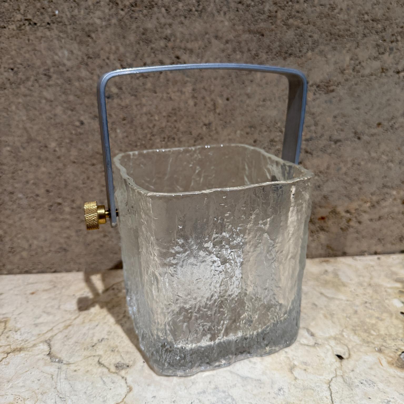 1960s crystal ice bucket in Scandinavian art glass
custom handle in aluminum and brass
8.5 tall with handle 5 H x 4.75 D x 6.75 W
Preowned vintage condition. 
Refer to images provided.
 