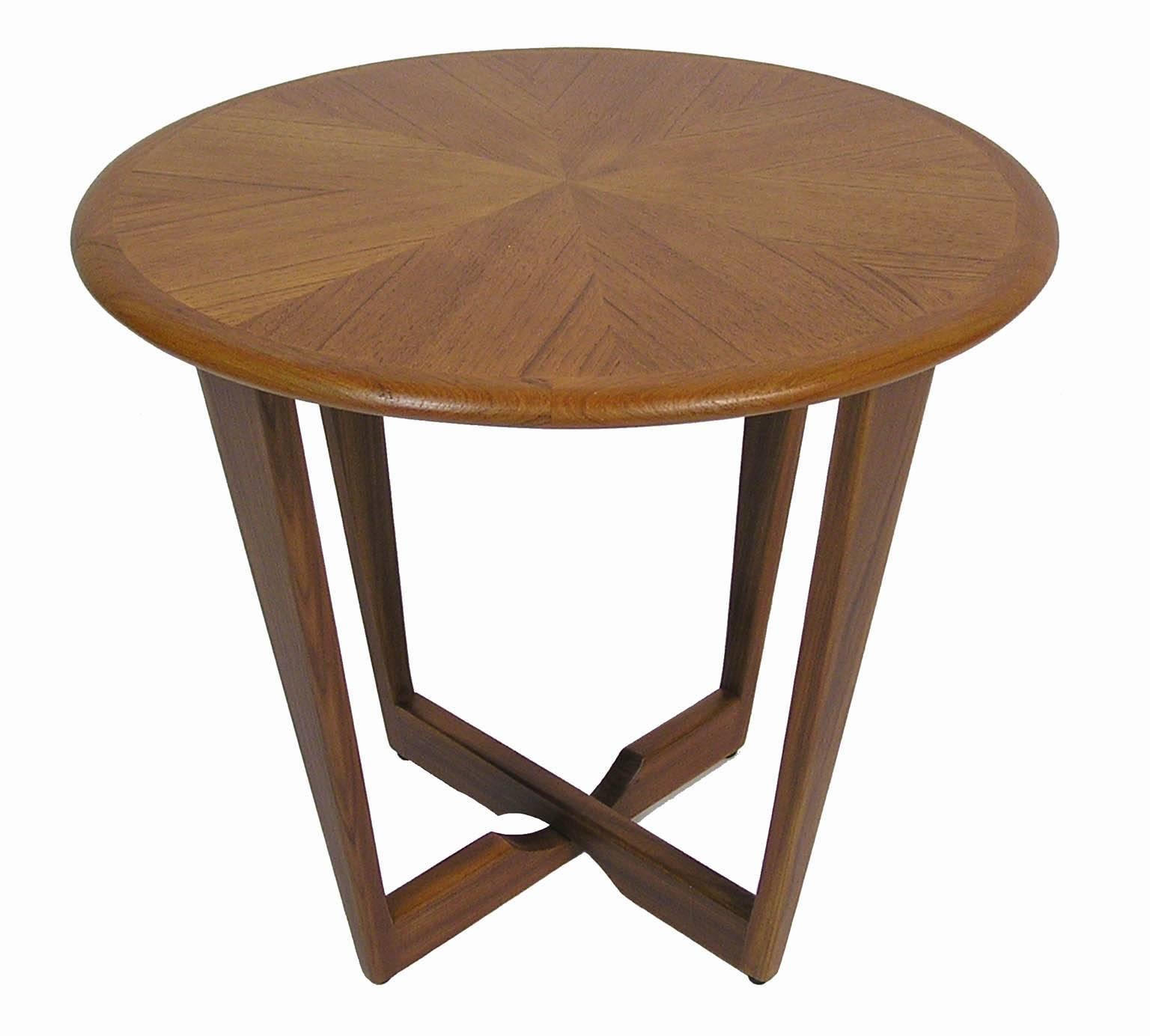 A gorgeous round teak occasional side table from the 1960s Scandinavian Modern inspired era. Features an attractive cross-grained top with a tapered solid teak base and trim. Excellent overall condition with a newly refinished top.