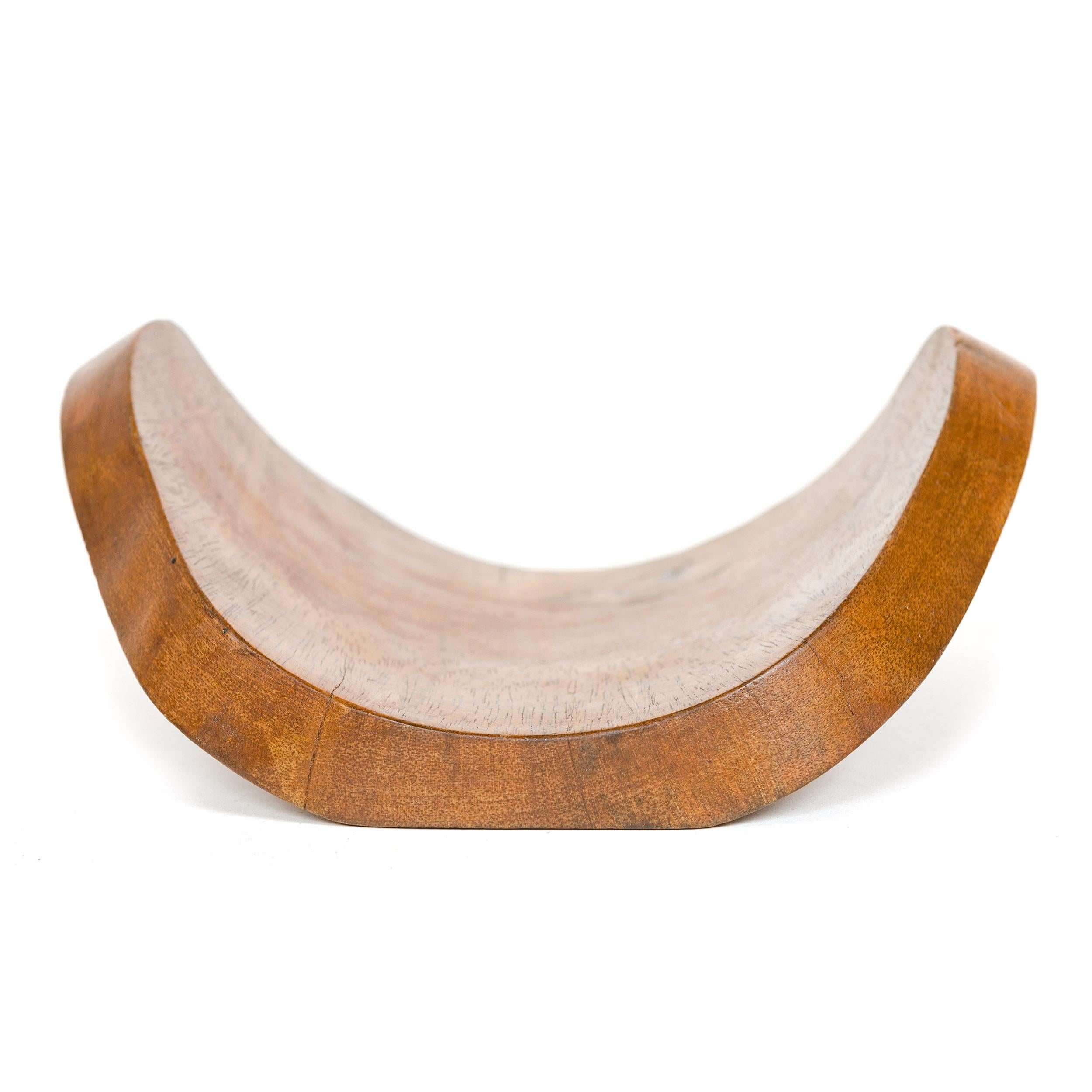 An uncommon teak center bowl.