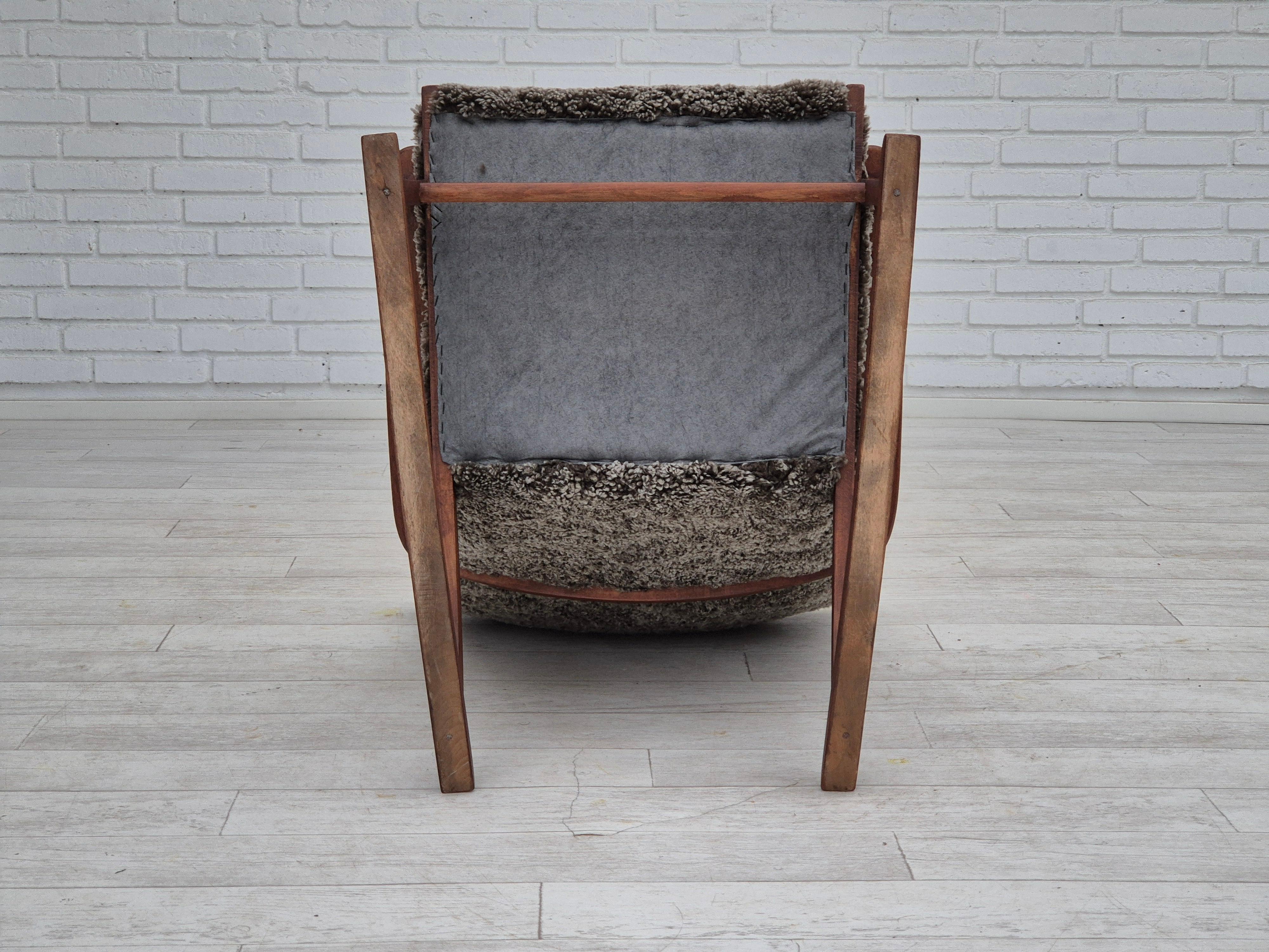 1960s, Scandinavian rocking chair, reupholstered in quality genuine sheepskin. 9