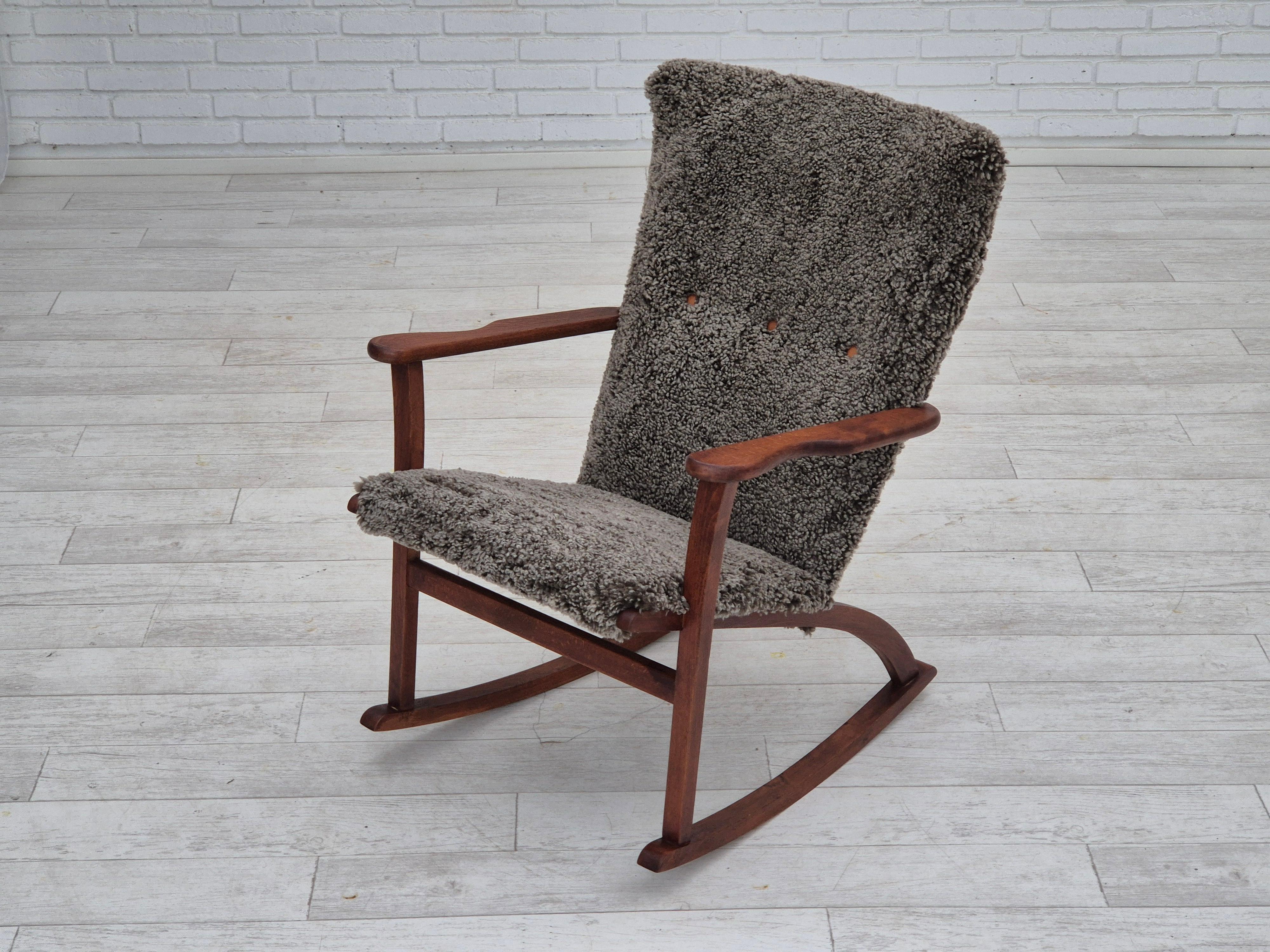 Lambskin 1960s, Scandinavian rocking chair, reupholstered in quality genuine sheepskin.
