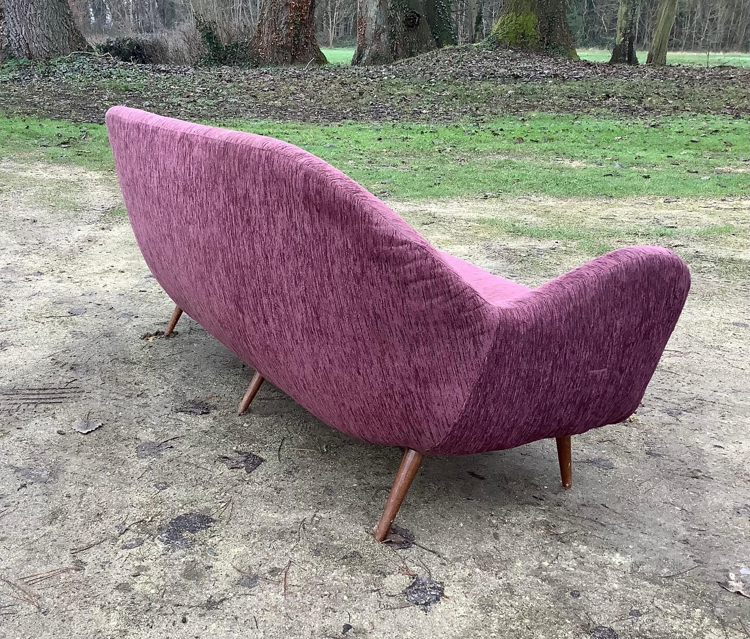 Rare 3 seater sofa with superb curves and lovely tapered wooden legs
Scandinavian Style Designer unkown.