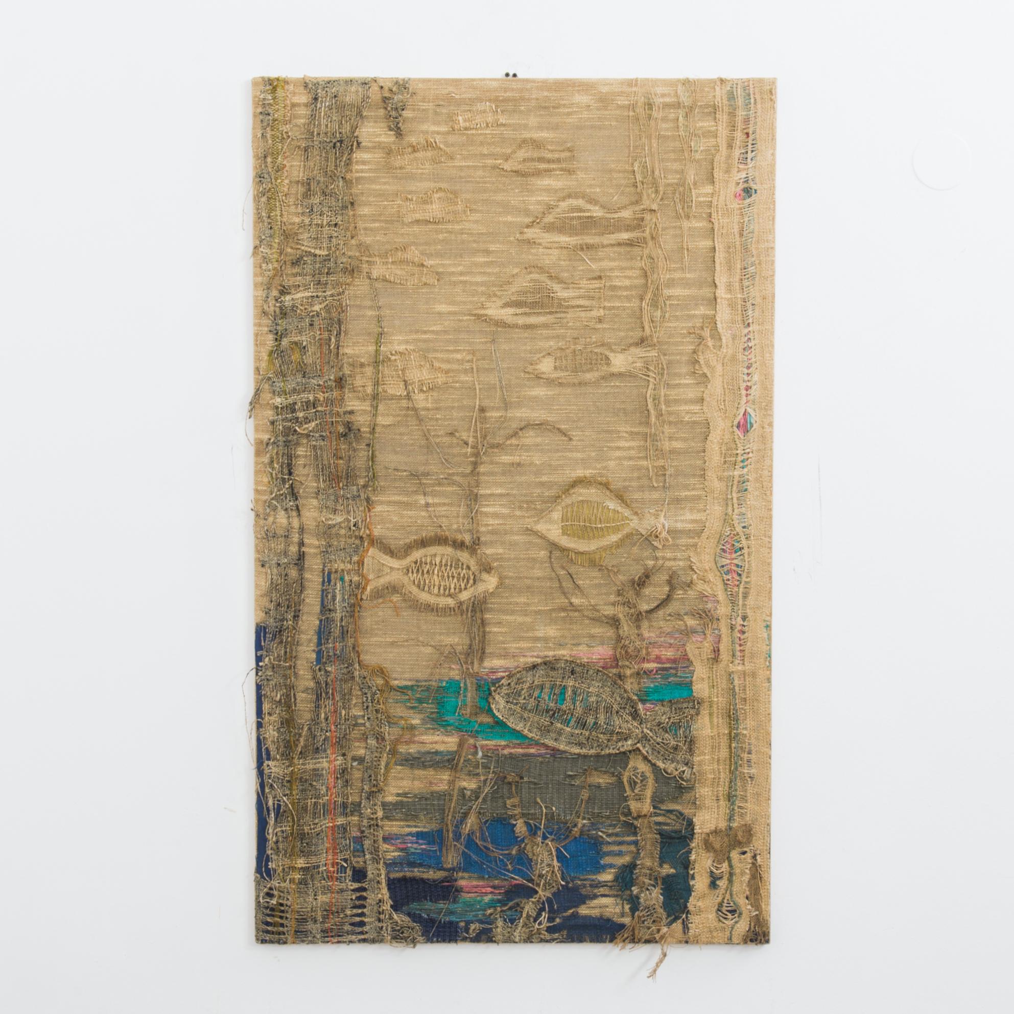 This artwork was made in Scandinavia, circa 1960, and plays with the qualities of jute to depict a dreamy underwater scene. The threads of the jute are layered, sewn together, and separated, creating the patterns on the fish and ripples in the sea.