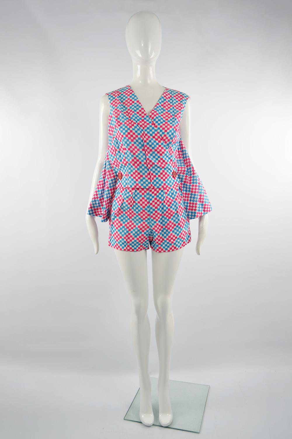 An incredible and fun sleeveless vintage women's playsuit / romper from the 60s by high end Italian label, Scarabocchio for luxury department store, Harvey Nichols. In a pink, white and blue lightweight cotton with a checkered pattern throughout,