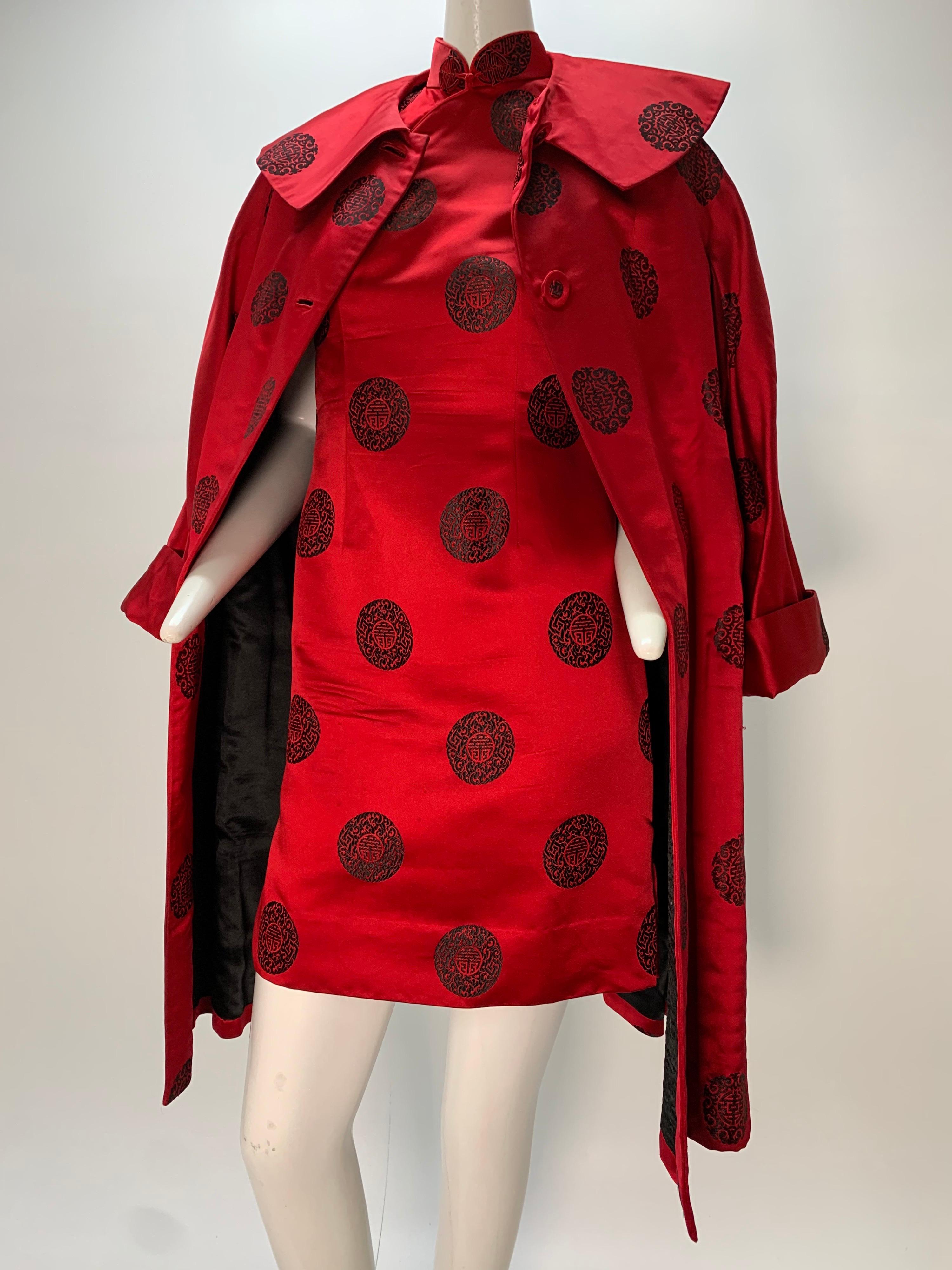 1960s scarlet and black Hong Kong heavy silk satin cheongsam mini dress and full cocktail coat ensemble. Dress is traditional cheongsam cut with short hem, and piped frog at neckline. Coat is full-cut and lined in black quilted silk with a wide