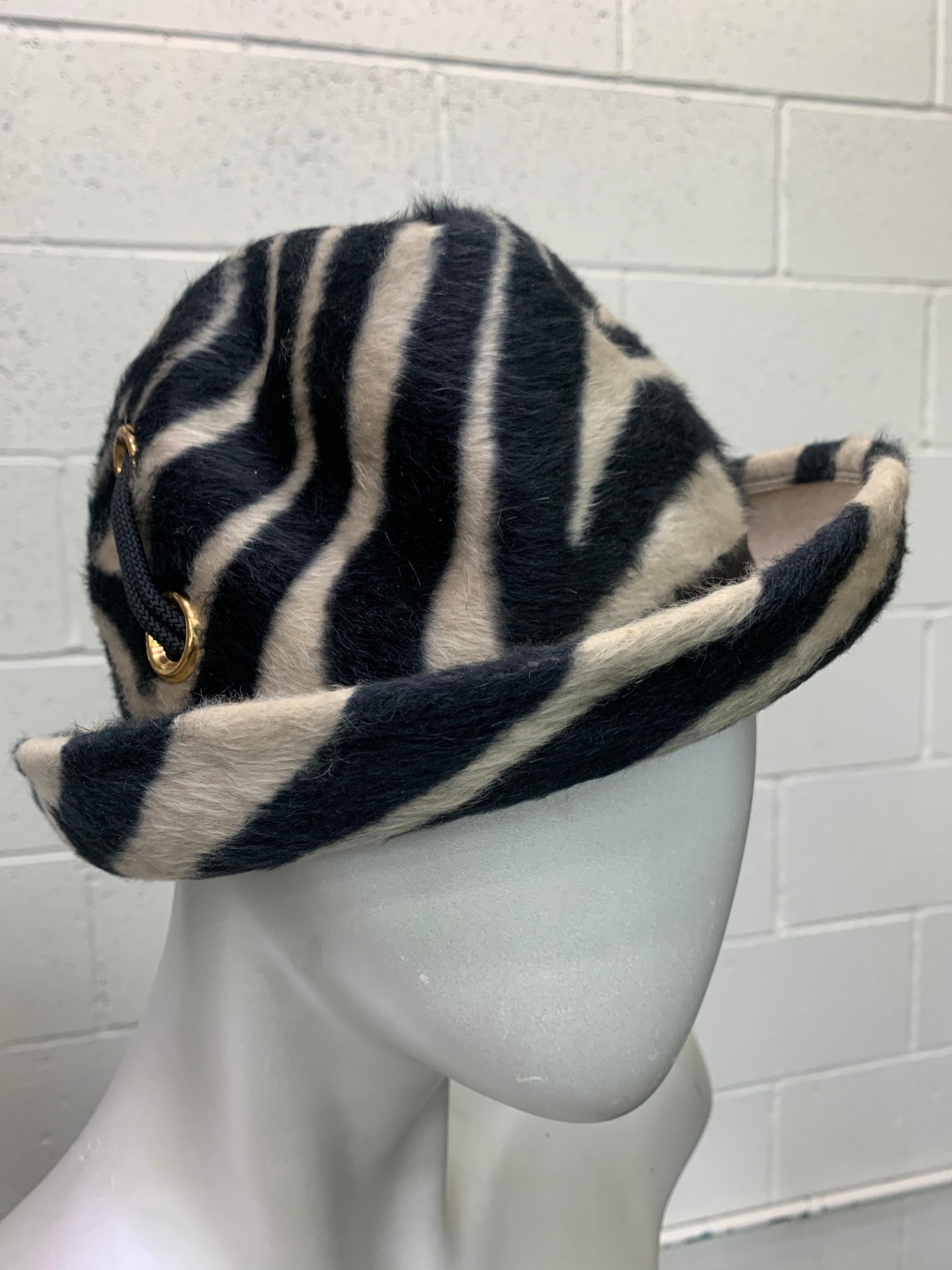 A striking 1960s Mod Schiaparelli Paris zebra striped fur felt narrow-brimmed fedora with gold-tone eyelet and cord lacing details. Size Small. 